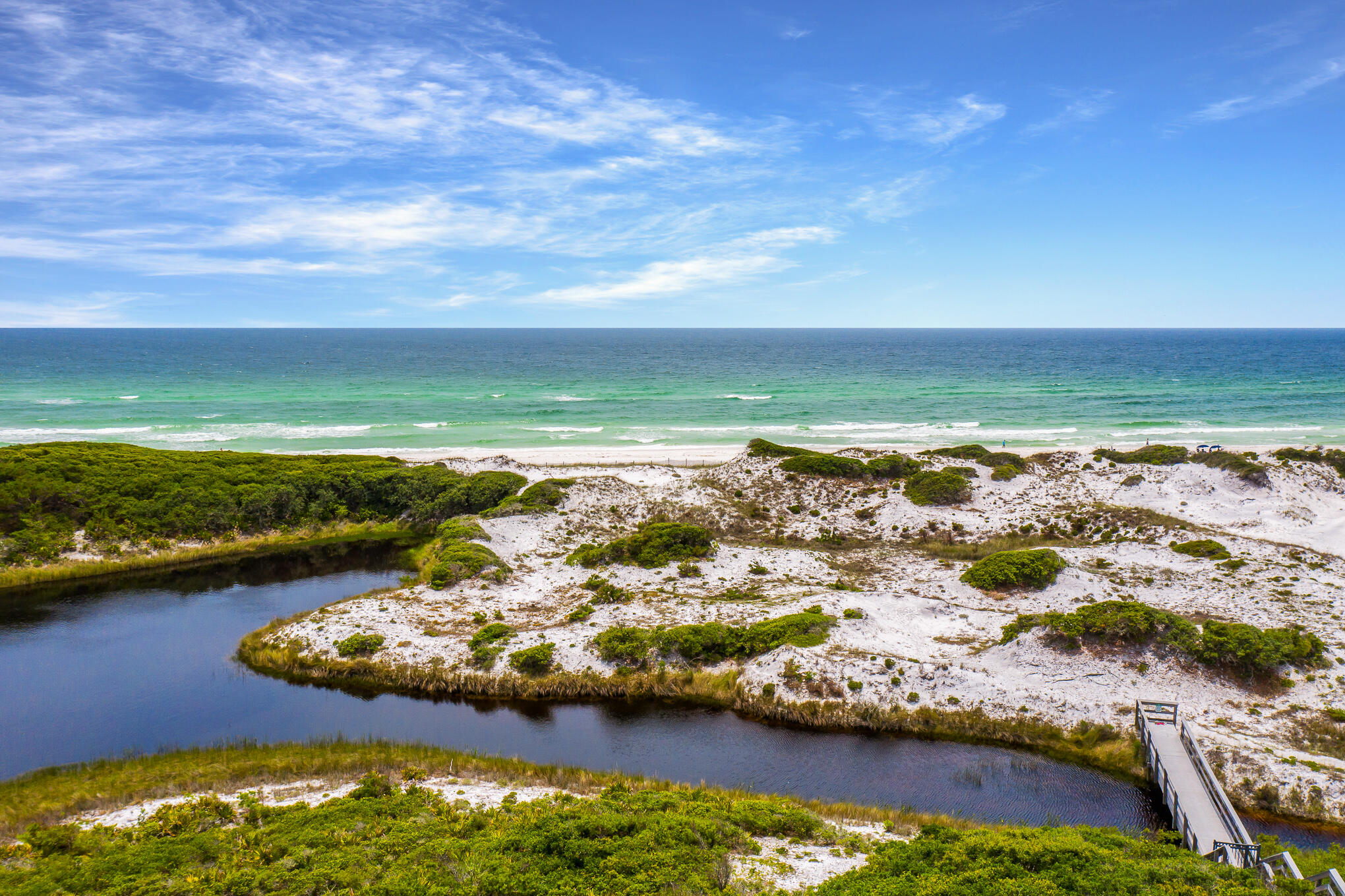 This one of a kind home site has unobstructed views to the pristine beaches of South Walton. The Retreat was St. Joe's first beach front development in 1999 and it is the most prestigious gated beach community on 30A! With just 90 exclusive residences, real estate at The Retreat is highly sought after, with four gated beach accesses across the community's 3,000 feet of private beach on the Gulf of Mexico, a coastal dune lake and a gulf-front resort-style beach club. Over 1,000 of the 3,000 foot beachfront area is a conservation easement and is never to be constructed upon ensuring the natural beauty of The Retreat will be preserved. The Retreat also consists of a 25-acre conservation preserve, a community treehouse and walking trails surround the property. Retreat's gated Grecian design private beach club that offers picture perfect views of the emerald green water and sugar white sands that the Gulf of Mexico is famous for. The Beach Club also provides a personal 3'x5' storage unit beneath the deck for each homeowner. Paddle board or kayak off The Retreat's private floating dock on Draper Lake. The Retreat offers security through a guarded entry and on-site patrols allowing for peace of mind and safety for all homeowners. The retreat is a short term rental restricted neighborhood. If you are considering a vacation or primary home in The Retreat, the location, privacy and natural beauty do not get any better than this! You will not find a more perfect beach! Do not miss out on the opportunity to build your dream beach house on this lot which has breathtaking views of both Draper Lake and The Gulf of Mexico!