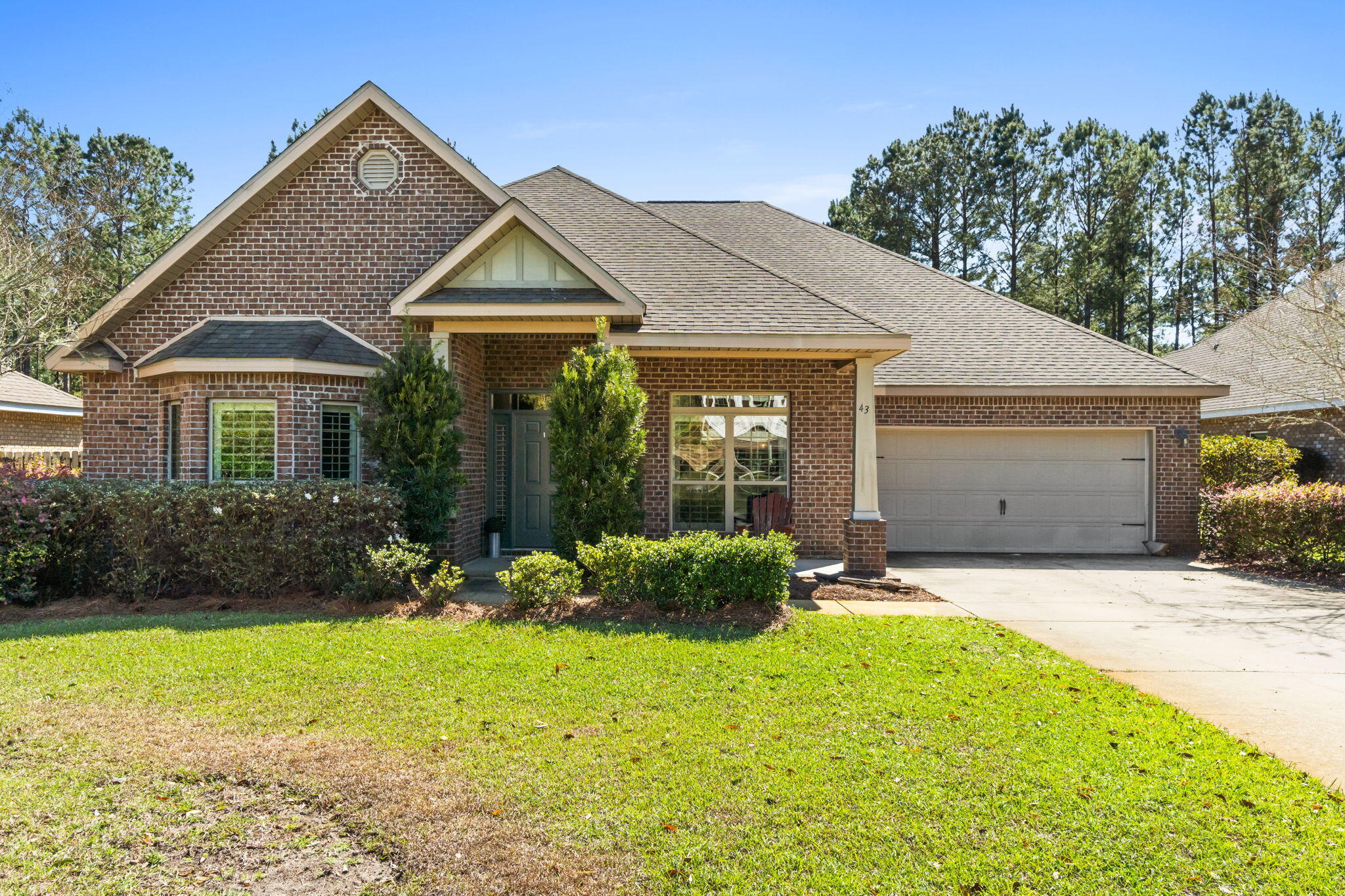 Recent Price Reduction!! Upgraded features throughout this McKenzie floor plan. One of the larger preserve lots in Whispers neighborhood. 5bdr,3baths w/office. This spacious home has Designer window treatments- Plantation shutters and blinds throughout. Split floor plan ensures privacy in all 5 bdrs. The living area has dbl trey ceiling, crown molding and stacked stone gas fireplace. Dining Rm has trey ceiling. Large Kitchen w/island and breakfast area overlook living area and sunroom. Granite countertops in kit and baths. Hardwood flooring and custom light fixtures throughout. Tiled sunroom overlooks the high ceiling screened porch. A deep backyard extends back to the wooded preserve providing privacy. Low maintenance Brick exterior. Enjoy using the wonderful amenities of Hammock Bay.