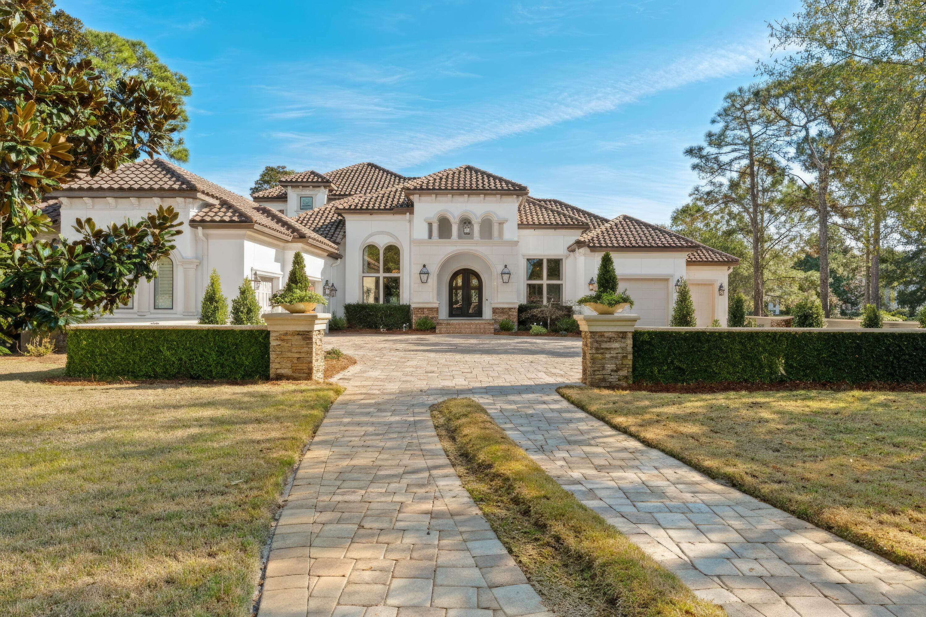 Step into a residence where refined design meets true entertaining luxury in the heart of Burnt Pine. From the moment you arrive, the home's striking curb appeal and beautifully manicured landscaping create an immediate sense of arrival. A spacious three-car garage offers ample room for vehicles, golf carts, and storage, while inside, the home unfolds with thoughtful design and elevated finishes throughout. 
Designed with both comfort and privacy in mind, every guest bedroom features its own en-suite bathroom—an exceptional detail that makes hosting family and friends effortless. Whether welcoming extended stays, holiday gatherings, or weekend guests, everyone enjoys their own private retreat while still feeling connected to the home's inviting flow. The primary suite is a true sanctuary highlighted by spa-like finishes and heated floors that elevate everyday living.

Entertaining continues seamlessly outdoors with a screened-in living area featuring a summer kitchen and poolideal for year-round enjoyment. This outdoor retreat overlooks the 10th hole of the Burnt Pine Golf Course, offering peaceful views and a sense of privacy rarely found. With a private elevator providing easy access across levels, this home balances luxury with livability at every turn. This home offers multiply ice machines and 2 Wine Refrigerators and 500 bottle plus plus Refrigerated Wine Room. 

Located behind the private gates of Sandestin Golf and Beach Resort, residents enjoy access to championship golf, private beach access, marina amenities, dining, shopping, scenic trails, and the convenience of a true golf-cart lifestyle. This is a home designed for those who value thoughtful design, gracious entertaining, and an elevated coastal lifestyle.