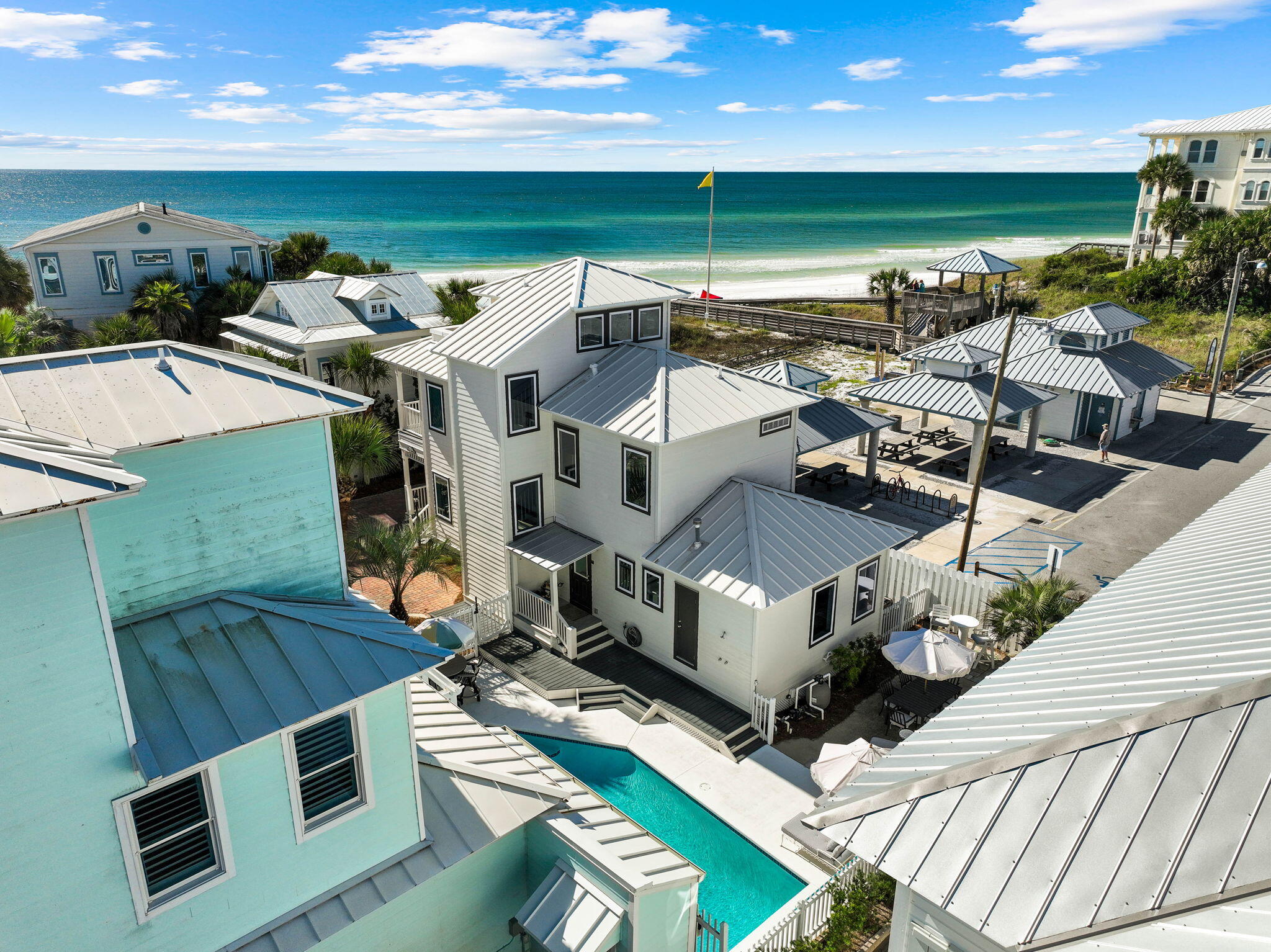 This three level beach home in Sunrise Beach, one of 30A's most desirable gated Gulf front communities, is just steps from your private beach walkover and the emerald waters of the Gulf. Enjoy panoramic beach views and the sound of the waves from balconies on every floor, or relax by your large private heated pool, a rare feature in this neighborhood. Inside, the recently updated open floor plan offers generous living and dining space alongside a well appointed kitchen, perfect for hosting friends and family. The first floor includes a bunk room with trundle, while the second level features two king suites, including the primary with a large covered balcony framed by mature palms and Gulf views. On the third floor, a cozy daybed surrounded by windows opens to a sun soaked porch, ideal for morning coffee or sunset cocktails.

This home also includes a Flood Zone X location, survey on file, and a private walkover to the beach right across the culdesac. Sunrise Beach offers two private walkovers, and you are within walking distance to Gulf Place, Shunk Gulley, and some of 30A's best restaurants and shopping. Sold fully furnished, with a short list of exclusions, this property is turnkey and ready to be your primary residence, private retreat, or high performing rental investment.