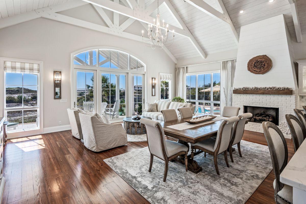 Picturesque in every way, this elegant legacy home nestled within the enchanting gated community of Four Mile Village is sure to please those longing for a truly private coastal ownership experience. Situated on a one-acre parcel, the expansive 5,552 total square foot floor plan is ideal for building lifelong memories along the Emerald Coast. New Orleans inspiration exudes throughout the architecture and interior details, such as the reclaimed heart pine flooring, soaring ceilings and crisply painted accent beams. Renovated in 2017, the masterful craftsmanship is found from within the five bedroom main home, as well as the carriage house with full studio apartment. Calcutta quartz countertops are found adorning the chef's kitchen as well as the six and one-half bathrooms throughout the coastal retreat. Poised for outdoor experiences, the large pool and sunning deck provide additional locales for relaxation, all with remarkable views of the Gulf of Mexico, and surrounding Coffeen Nature Preserve.