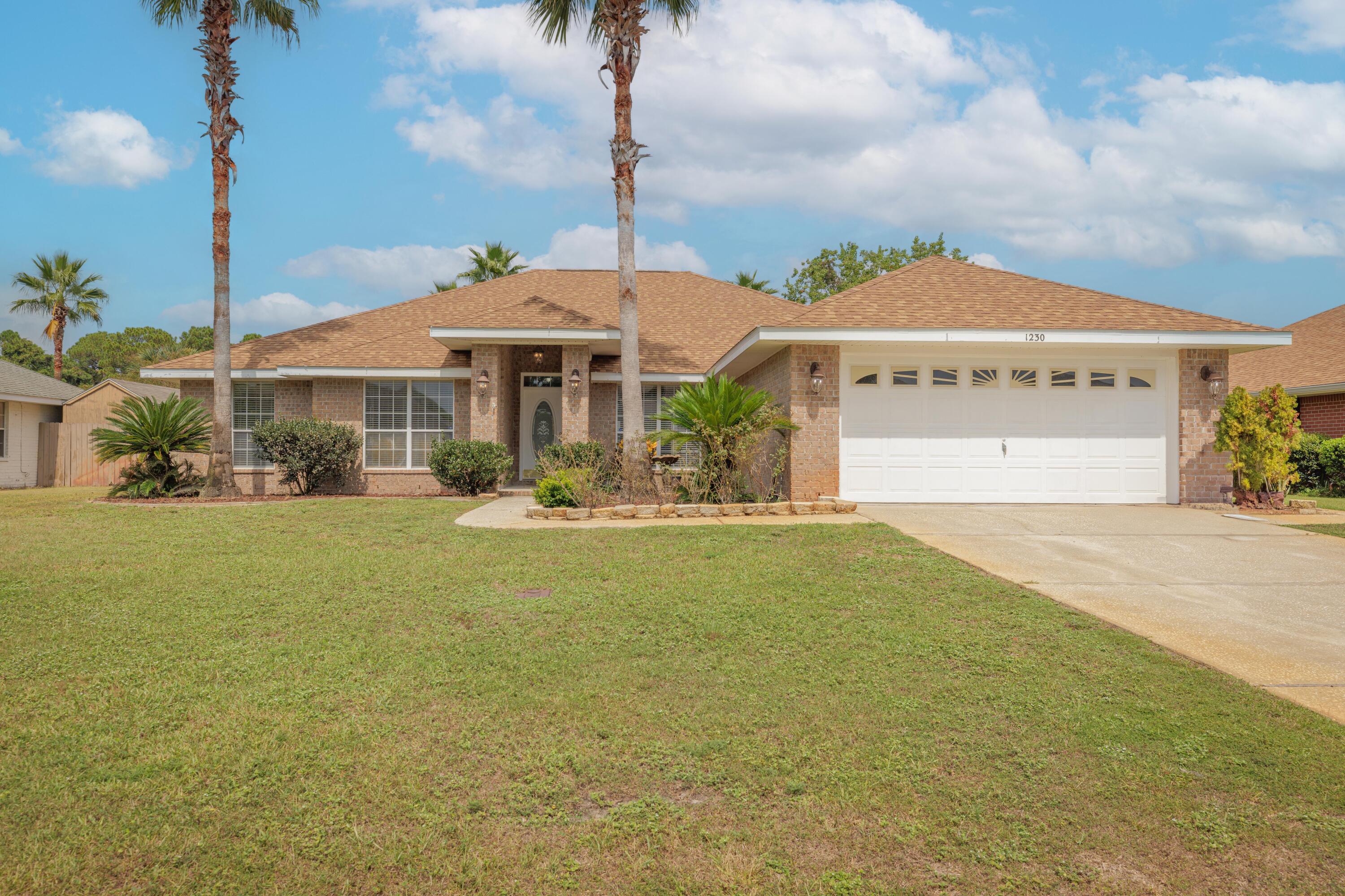 Welcome to 1230 Grand Ridge Circle, a spacious and beautifully maintained 4-bedroom, 2-bath home located in the highly sought-after Grand Ridge community of Gulf Breeze. Boasting over 2,500 square feet of open-concept living space, this home features a bright and airy layout perfect for both everyday comfort and entertaining. The kitchen offers functional design with quality finishes, while the split-bedroom floor plan ensures privacy for family or guests. Situated on a generous 10,454 sq ft lot with no HOA, there's ample space for outdoor enjoyment or future customization. Additional highlights include a two-car garage, and placement within the top-rated Gulf Breeze school district. Just minutes from parks, beaches, shopping, and downtown Pensacola, this home is move-in-ready.