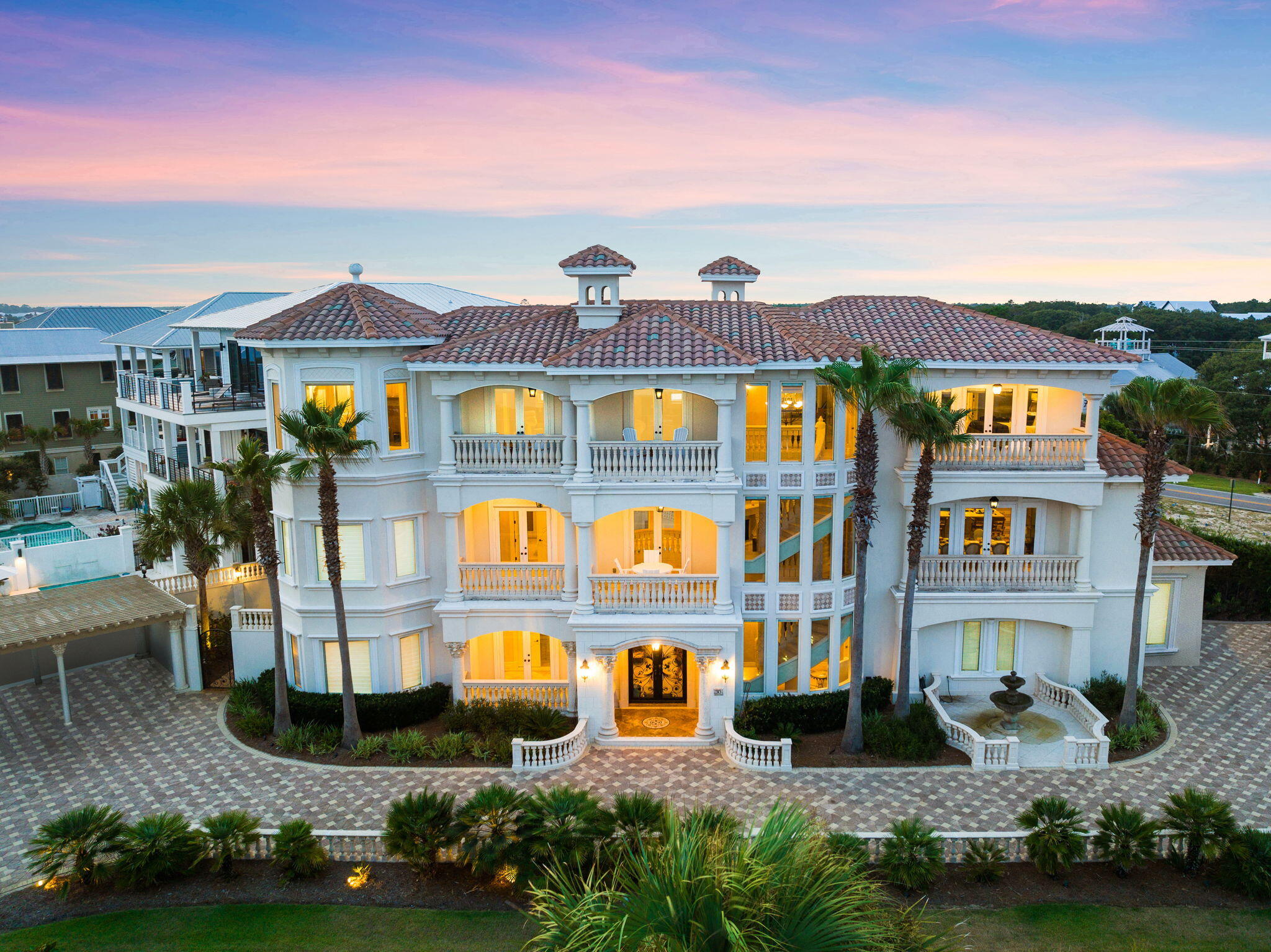 Introducing a breathtaking coastal haven along 30A, this exceptional residence stands as a true masterpiece, poised just moments away from the pristine white sands and captivating emerald waters. Brace yourself for the enchanting allure of the Gulf Views that adorn the bedrooms, balconies, and opulent primary bathroom suites. Enter the world of 30 Pelican Circle, affectionately known as 'All Is Well,' where sheer magnificence unfolds. Step through the private entrance, greeted by an elegant circular driveway adorned with a bespoke pergola. Beyond the striking iron doors lies a grandeur-filled spacelofty ceilings in the foyer, a state-of-the-art home theater, a private elevator, and a conveniently placed laundry room. The first floor hosts a generous bunk bedroom, a regal king bedroom, and a luxurious stone bathroom with a lavish walk-in shower.

Venture further to discover the mesmerizing backyard oasisa secluded pool area embraced by a majestic stone wall that grants serenity amidst the lively 30A. Here, indulge in the built-in grotto, delight in the cascading waterfall, or relax in the serene spa tub. Ascend the stately stone staircase to the second floor, where the main family room beckons, complete with a large flat-screen TV, balconies offering sweeping gulf views, and an additional balcony overlooking the pool courtyard.

The gourmet kitchen is a haven for culinary enthusiasts, perfect for crafting family feasts and entertaining guests. Adjacent, a dining room for eight, graced by a private balcony with panoramic views of the tranquil waters. Journey through the extended hallway boasting stunning ocean vistas to uncover two spacious king bedrooms sharing a full bathroom with a walk-in shower and dressing room.

Ascending to the third floor via the winding stone staircase reveals double glass doors leading to the home's gym. This floor also hosts a second laundry room and an additional half bath. Adorned with beauty, a gorgeously appointed guest primary bedroom awaits, boasting a private ensuite bath with a soaking tub, shower, and a private balcony. The pinnacle of luxury awaits in the grand primary suite, featuring a large private balcony, custom closet, dressing room, and a regal bathroom with heated floors, a Jacuzzi tub, and a walk-in showerall commanding breathtaking Gulf vistas.

In conclusion, "All Is Well" stands as a testament to architectural splendor, offering an unparalleled coastal living experience. Beyond its breathtaking beauty, this residence presents a compelling investment opportunity, potentially generating an impressive $300k in rental income.