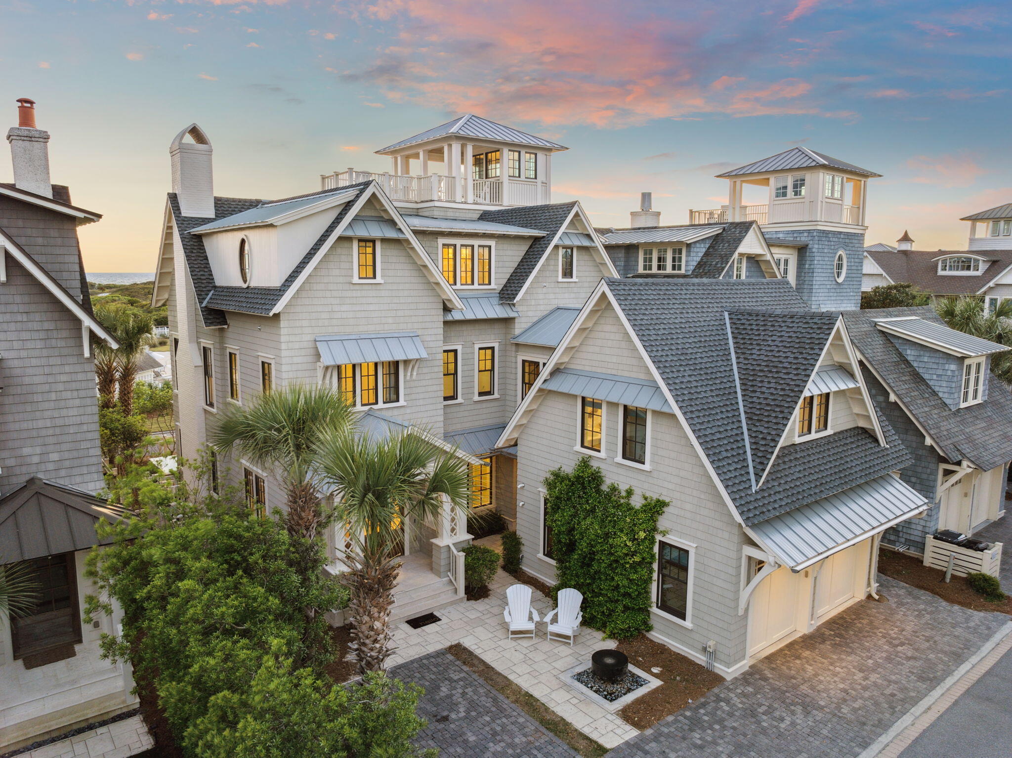 Perched gracefully within the coveted gates of Watersound Beach, this architectural gem redefines casual elegance along the Gulf Coast. Thoughtfully designed by TS Adams and masterfully built by Gulf View Construction, this four-story residence seamlessly blends refined craftsmanship with the laid-back luxury of coastal life. Positioned on a premium lot with unobstructed views of rolling dunes and shimmering Gulf waters, the home invites you in with accordion-style doors that dissolve the boundaries between indoor comfort and outdoor splendor. Multiple open-air terraces and covered decks span every level — including a fourth-floor tower—creating the perfect backdrop for sunset cocktails, stargazing soirees, or sun-drenched afternoons. At the heart of the home, a gourmet chef's kitchen dazzles with lustrous granite counters, shiplap accents, a Dacor 6-burner gas range, and a Sub-Zero refrigerator  tailored for both culinary ambition and relaxed entertaining. Five uniquely styled bedroom suites are thoughtfully arranged across three floors, each offering proximity to the home's inviting gathering spaces. Every level features its own lounge, wet bar, half bath, laundry, and ice maker  designed with both convenience and comfort in mind.

Step outside into your own private resort. A heated infinity-edge pool anchors the outdoor living area, while a tranquil coastal bed swing invites quiet reflection. Three wood-burning fireplaces  two outdoors and one inside  set the tone for cozy gatherings year-round. Multiple lounging nooks, outdoor televisions, and a screened first-floor porch create versatile spaces for relaxation and entertainment. The lush garden gate opens to a boardwalk that winds through protected dunes, leading to the sugar-white sands of the Gulf. Along the way, enjoy access to the neighborhood's pool and dining amenities, just moments from your door.

Meticulous ownership is evident throughout, with a long list of premium upgrades and thoughtful care. In 2024 alone, the home saw a new composite/metal roof, new shake siding, fresh exterior paint, full exterior waterproofing, and a complete third-floor interior renovation. While the third-floor HVAC system is entirely new, the existing outdoor units were retained  ensuring transparency while showcasing the investment in comfort. In 2023, two tankless water heaters were installed, the exterior fencing was replaced, and the screened porch was added. In 2025, the pool heater motherboard and lithium golf cart batteries were updated to maintain peak performance.

Beyond upgrades, consistent maintenance speaks to a standard of excellence. Monthly pest control has been in place since construction. Doors and windows receive annual care from EF San Juan. Appliances have been proactively serviced by Mr. Appliance since 2020, and the elevator is professionally inspected by Panhandle Elevator each year. A fully integrated Control4 smart home system, installed and maintained by WattSound, offers modern convenience with intuitive control.

Wrapped in a classic Nantucket-style exterior with mildew-resistant paint, stone pavers, and low-maintenance native landscaping, this home was built for enduring beauty and ease. The elevator services all three floors, ensuring accessibility for every generation. Never rented and impeccably maintained, this coastal retreat is more than a home  it's a legacy, ready to host cherished memories and timeless moments along Florida's Emerald Coast.

Reach out to us for cost to own figures + rental projections.