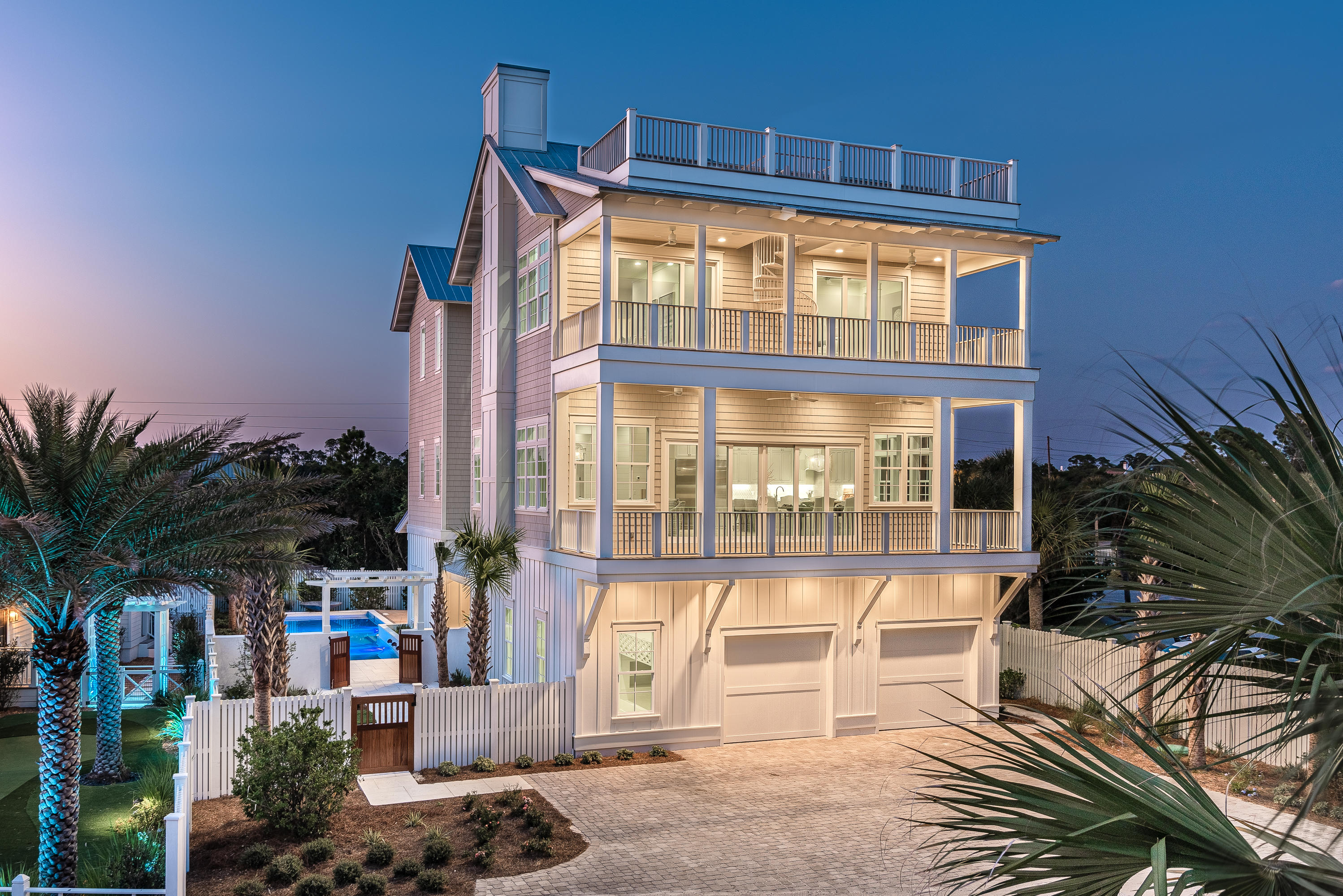 Construction is now complete on this substantial retreat located just one tier off the Gulf in Seacrest. The home spans over 5,476 sqft (heated/cooled), and includes 8 bedrooms/8.5 baths, and 3 separate living spaces. The home also offers exquisite outdoor living spaces like a 4th floor desk with unobstructed Gulf views, south facing decks on the 2nd and 3rd levels, a luxurious pool and courtyard, and an oversized 2 car garage.
Enter the property through the teak wood gates into the homes courtyard of peacock pavers and lush landscaping. The signature 10ft robin's egg blue door welcomes in guests to the home's grand entryway and first floor living area. The first floor living room complete with wet bar with wine fridge, a double bunk room, 1 1/2 baths and this floor's laundry facilities finish out this space. 

Take the grand staircase with custom wood railing to the second floor where you'll find another 2 bedrooms and bunk room, each with their own baths, a sitting area, the main living and dining area and a well-appointed kitchen with Wolf and Subzero appliances, marble waterfall island, grand vent hood. The living area is finished beautifully with one of the home's 2 gas fireplaces, and wall of sliders opening to an expansive south-facing deck. 
The 3rd level of the home holds the Gulfview master bedroom and bath, a 3rd living room, as well as 2 more bedrooms and a bunk room all with their own full baths. The 3rd floor living space and master both open to another deck spanning the width of the home that offers Gulf views and a spiral staircase that takes you to the 4th floor viewing deck. Here you have the pinnacle of high elevation panoramic views of the emerald green Gulf waters. 

With plenty of room for guests to gather together or retreat, and the gorgeous Gulf beaches just a few steps away, you have all the relaxation and entertainment here to graciously host your family and friends. And with yearly rental projections all over $300K, this investment opportunity is one you won't want to miss!