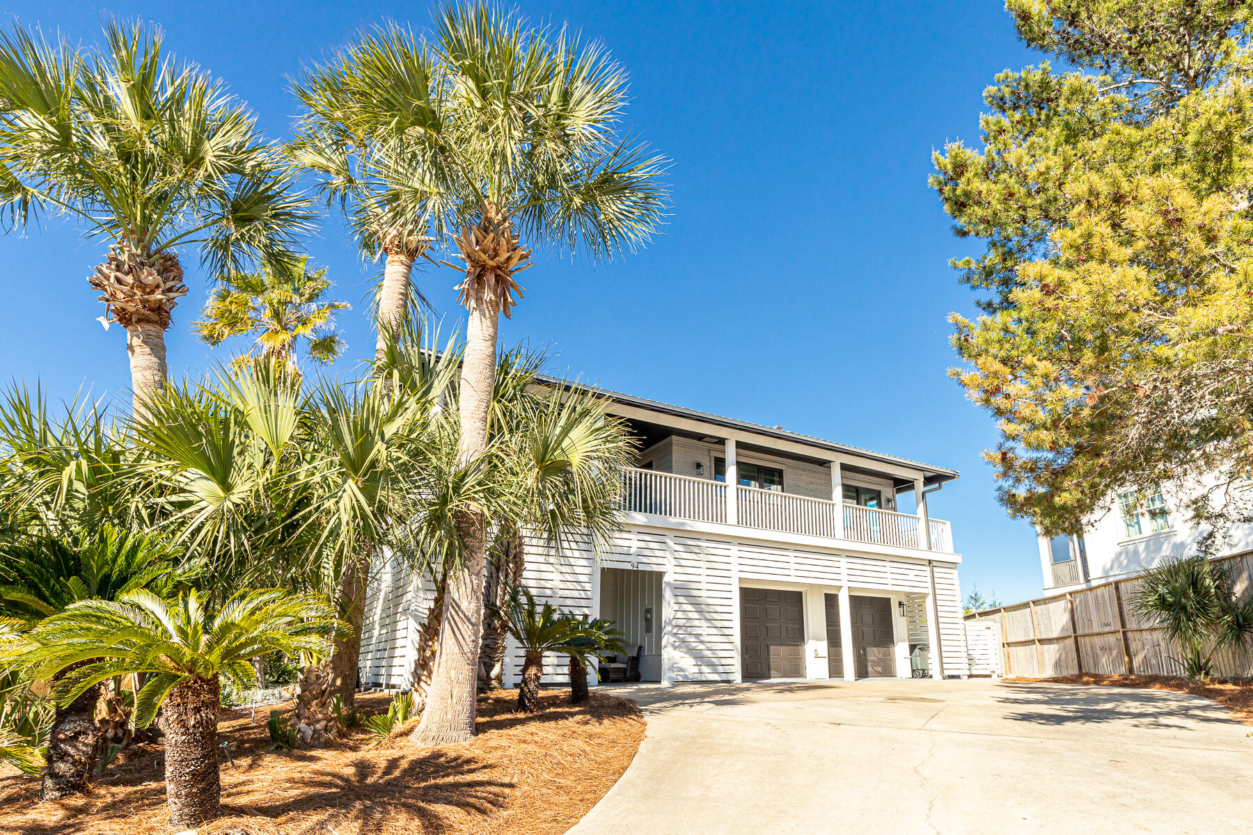 Situated on a rare ½ acre lot at one of the highest elevation points on 30A, this Blue Mt Beach home with a private pool, gulf views, fully furnished and no HOA is an investor's dream (projections of $280,000). Featuring 6 bedrooms plus 2 bunk rooms, 5 full baths, 2 kitchens, 2 sets of Washer/Dryers and several gathering areas, this sprawling layout can easily accommodate parties of 25 or more while maintaining a sense of privacy.   
An extensive ''down to the studs'' remodel includes a new metal roof, windows, doors, siding, upgraded plumbing, electrical, kitchen, bathrooms, decking, LVP flooring and more.  

Upstairs, the living area and dining room meet with a wet bar which wraps around to a peninsula gas fireplace. High impact windows and glass sliders offer ample natural lighting throughout the open floor plan.  The gourmet kitchen is complete with a gas cooktop, new stainless steel appliances, quartz countertops and casement windows.  A breakfast nook and butlers' pantry frame the kitchen with access to the gulf-facing deck. 
Two the four bedrooms upstairs include private baths and glass sliders leading to the deck with panoramic views. Downstairs, you'll find two bedrooms plus two bunk rooms along with two full baths, the second kitchen, a living area, and two laundry centers. 

An expansive covered wrap around deck allows ample seating with peekaboo gulf views. A sun deck overlooks the private pool and yard. Downstairs, the covered porch continues around the home with several seating and grilling areas. In the backyard, a covered patio next to the pool has additional seating around the fire. 

The 800 sq ft heated and cooled pool house with potential to convert to an in-law suite has also been updated with a new roof.  The expansive drive and oversized two car garage can easily park 15 vehicles or provide storage for boats or RVs.  The heated and cooled space could be perfect for yoga, sound or art studio.  

Take advantage of this spectacular investment opportunity in the desirable Blue Mountain Beach community! Half a mile from the sugar sand beaches of 30A with access to miles of state park trails popular for biking and walking just 1/4 mile away. Less than half a mile to hotspots including the creamery, Blue Mabel, Cowgirl kitchen, and restaurants and shopping in Redfish Village. 

Rental projections and a full list of updates can be found under the documents section in MLS. This home is ready for a busy spring rental season  including 6 seater golf cart and bikes. Almost new construction at fraction of price in neighborhood. Other newly built home in area selling over $900 a foot. This lot size and price per foot makes this in amazing deal. 

The main house is 4,346 square feet of heated and cooled living space.  The 3rd car detached garage of additional heated and cooled space of 800 square feet.