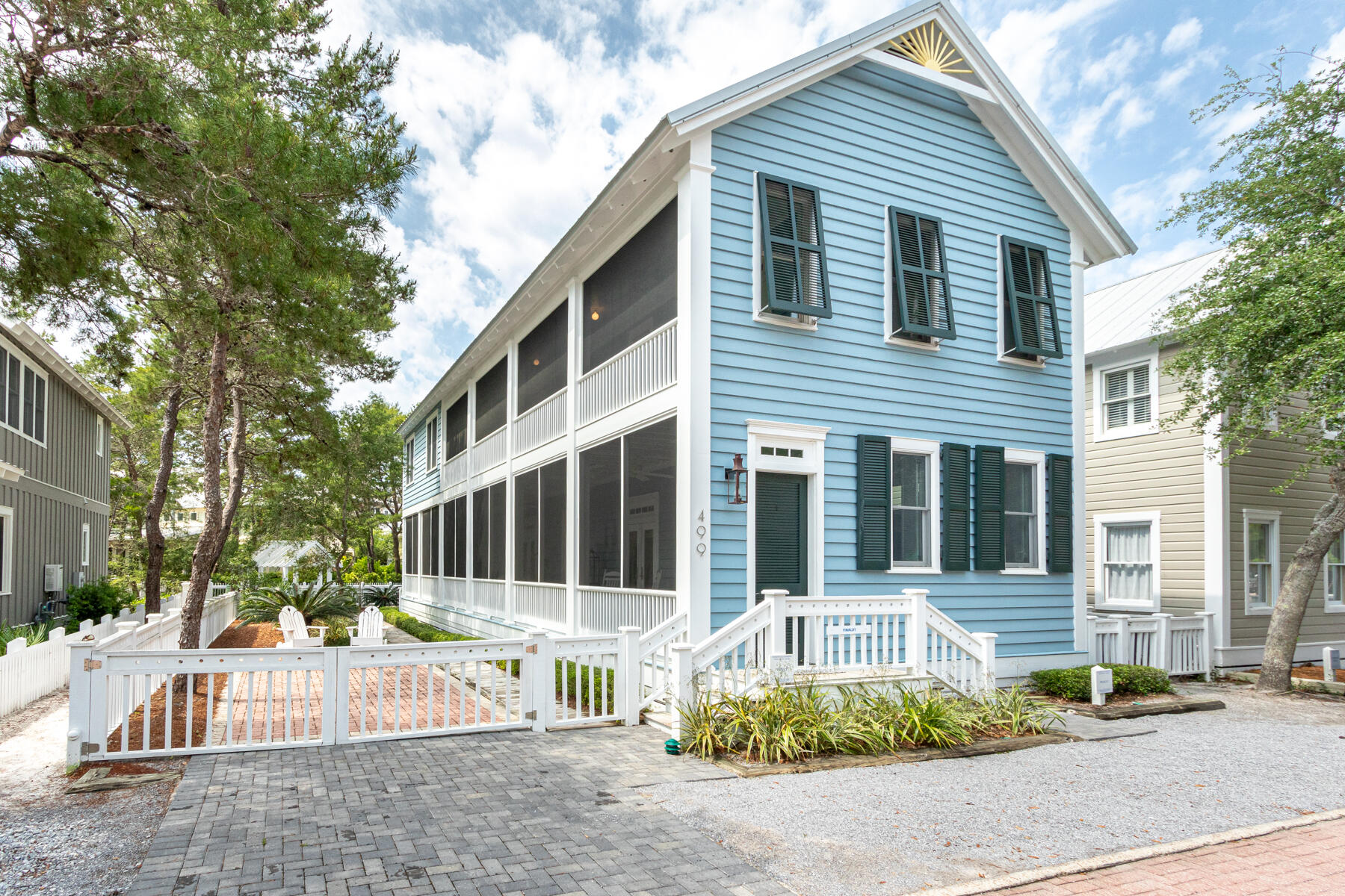 FINALLY! This light filled, spacious cottage is a family dream house. Built in the classic Seaside style and located near pools, play ground. fitness center and just a stroll to town center. The house speaks comfort and easy living. A wall of French doors opens the capacious main floor living area onto a screened porch that runs the full length of the house. The 30' x15' living and dining area features 10' ceilings, beadboard walls and a fireplace surrounded with bookcases. Crown molding and oak floors used throughout the house. The kitchen has a pass though to the dining area and includes black and white tile floors, granite countertops and stainless steel appliances.  Half bath and laundry room also on first level. Upstairs, the spacious master suite opens onto the second level screened porch. Master bath with double vanities and shower has room to add a whirlpool tub. The wo guest bedrooms share a full bath. Host your family picnics or barbecue on the brick paved patio under the shade of the oak trees. Private outside shower. Room to enlarge. This beach house is in mint condition and ready to make your dreams come true.