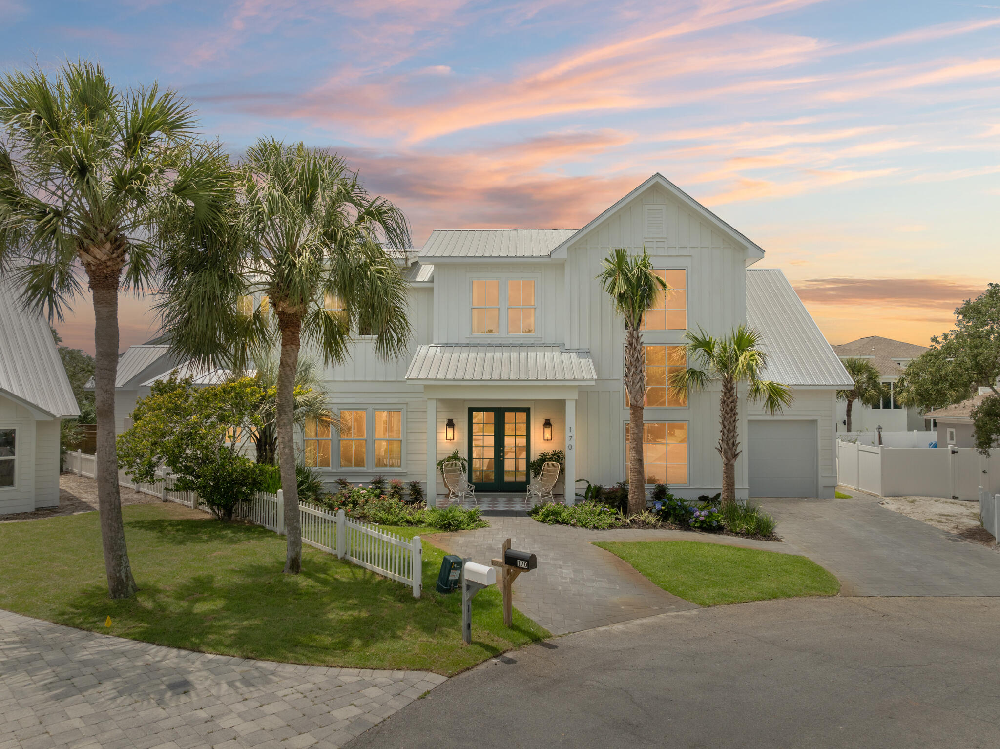 Welcome to The Palm Parlour! This vibrant and unique beach retreat is tucked away within the exclusive community of Sand Cliffs on the Gulf, located on the sought-after East end of 30A. This stunning home features 4 bedrooms + bunks and 4.5-bathrooms, plus bonus media room and library loft boasting across 3,993 sqft of living space. Stepping inside, you are greeted by the beautifully designed open-concept living space featuring a beautiful terrazzo tiled fireplace as the focal point of the room and bi-fold doors that create a seamless flow to your outdoor oasis. The dining area is a showstopper, drawing your eyes to the bold, de Gournay hand painted wallpaper mural complete with chic European style café seating. The vibrant design continues into the Chef's kitchen.. equipped with a mint green Lacanche 6 burner dual-fuel range, custom scalloped range hood, oversized rounded island, and gorgeous Calacatta viola marble counter tops in kitchen and pantry. The East wing is home to the primary suite featuring vaulted ceilings, spacious walk-in closet, and spa-like bathroom complete with Rose Cristallo quartzite counter tops and vintage murano glass light fixtures. On the primary level you will also find the laundry room, walk-in pantry, and a funky half-bath with direct access to your outdoor retreat. Step outside and enjoy the generous lanai with checkered tile inlay, sparkling pool surrounded by lush landscaping, and conversational gas fire pit. As you head up the stairs, you will be greeted by a stylish loft library with built-in shelving perfect for displaying art, books and family keepsakes. The second level is also complete with ample sleeping space for family and guests, with 3 additional bedrooms and 3 bathrooms, all with their own personalites. You'll also find thoughtfully designed bunks that add a functional touch. You will also find a moody bonus media room perfect for cozy movie nights in. The second level balcony and rooftop terrace provide relaxing spots for morning coffee or listening to the waves roll in! Residents of Sand Cliffs can enjoy private deeded beach access to the infamous 30A sugar-white sands and emerald waters. This one-of-a-kind home in Sand Cliffs offers the perfect blend of exclusivity, vibrancy, and relaxed beach living with no short-term rentals allowed, ensuring peace and privacy year-round. Don't miss this rare opportunity to own a slice of paradise in one of 30A's most desirable neighborhoods!