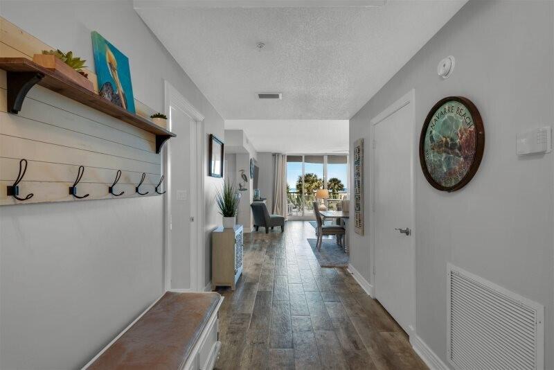This 3br/3ba 1st floor condo has a second level view. It's tasteful pristine Coastal Cottage décor captures the essence of Navarre Beach. There is no comparison to the trend setting architecture, the spaciousness, the privacy, and the multiple exposures to the Gulf creating a life style like no other. This development is famous for its private entry ways, circular terraces overlooking the Gulf. Amenities include covered parking, Olympic size swimming pool, pickle ball and tennis courts, fitness room and social center with a full kitchen for entertaining.