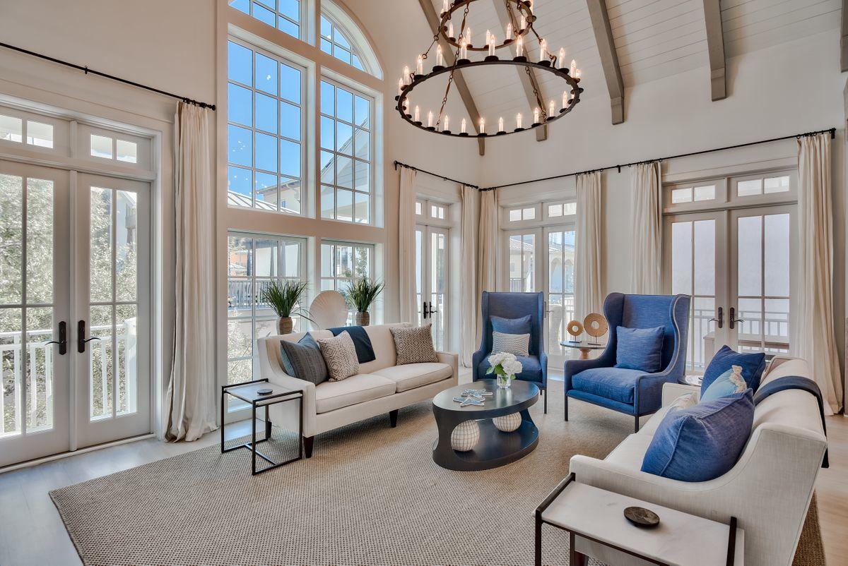 Located in a prime position six houses back from the sparkling white sand of Rosemary Beach, this spacious home has plenty to recommend it. Five bright bedrooms, a two-car garage and more than 800 square feet of outdoor living replete with private courtyard, pool and summer kitchen are just the beginning. A profusion of architecturally-designed windows and French doors deliver a sense of airy spaciousness and soft natural light. Cool travertine flooring on the home's first floor gives way to hardwood and lofty ceilings on the second. You'll be drawn to the finely-appointed chef's kitchen, recently renovated with marble countertops and light-colored cabinetry. Generous terraces and shady porches all boast top-of-the-line Ipe wood decking, providing ample space for sunbathing, quiet reading  soft natural light. Cool travertine flooring flows beneath the lofty cathedral ceiling, giving way to hardwood elsewhere in the home. You'll be drawn to the marble-topped island in this chef's kitchen with its pristine white cabinetry. There's a full-size gas range beneath a huge hood and a cabinet front refrigerator, putting everything at your fingertips. Step outside and appreciate the serene pool area and fully equipped outdoor kitchen in a surprisingly private courtyard setting. Generous terraces and shady porches all boast top quality Ipe wood decking. You'll find ample space for sunbathing, quiet reading and dining while enveloped in gentle sea breezes. Discover your own favorite breakfast café and intimate boutiques for browsing in the neighborhood. The soft white sandy beach is a just a minute away for swimming and shelling. Return home from a peaceful stroll and relax on the swing seat, watching the world go by.