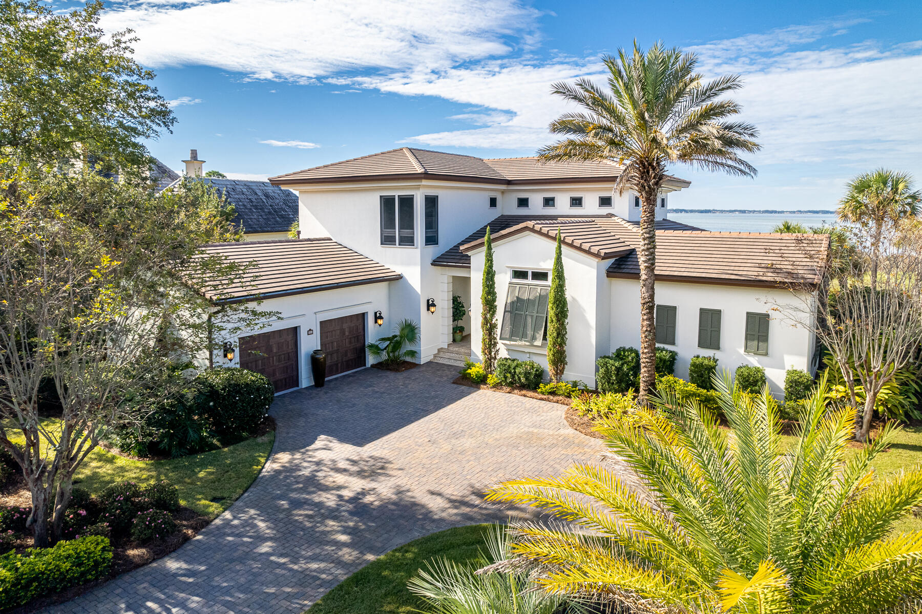 Incredible views over the 14th hole on Burnt Pine Golf Course and Choctawhatchee Bay can be enjoyed from this immaculately maintained home located on a private cul-de-sac within the exclusive, gated community of Burnt Pine. The seller is offering this estate fully furnished with a golf membership to Burnt Pine! The moment you walk through the mahogany French doors, you will be immersed into a great room with soaring cathedral ceilings and full-height windows that frame stunning views of the golf course and bay. Easy glide storm doors egress to the 680sqft screened lanai featuring a summer kitchen, gas fireplace and cozy lounging areas. The main floor features the primary suite, den/4th bedroom, and gourmet kitchen equipped with high-end stainless appliances, wine cooler, and ample storage. The second floor offers two additional guest bedrooms both with en suite baths.  Extensive renovations include a summer kitchen, storm shutters, outdoor patio and expanded driveway, new roof, new HVAC and more. The spacious garage will keep all your vehicles, golf carts and water toys safely stored behind new garage doors.
As an introduction to the Sandestin lifestyle, we invite our new owners to explore amenities that make Sandestin special. The listing brokerage and seller(s) are presenting the buyer(s) of this property with (2) 90-minute rounds of Tennis court time, a golf foursome at one of our three championship courses, and a round of golf for up to four (4) players at the unrivaled Burnt Pine Golf Club.
Sandestin Golf and Beach Resort features more than seven miles of beaches and pristine bay front, four championship golf courses, 15 world-class tennis courts, a 226-slip marina, a fitness center, spa and celebrity chef dining. Shop, dine and play at the charming pedestrian village, The Village of Baytowne Wharf and more. Inside the gates of the resort, residents enjoy a balanced lifestyle of high-class living, spanning the 2,400 acres from the beach to the bay. Everything within the gates of the resort is accessible by golf cart or bicycle. The entire resort is interconnected by miles of pedestrian, bike and golf cart paths that weave through groves of live oaks, meandering past natural lagoons, fountains, man-made lakes, and meticulously landscaped fairways.