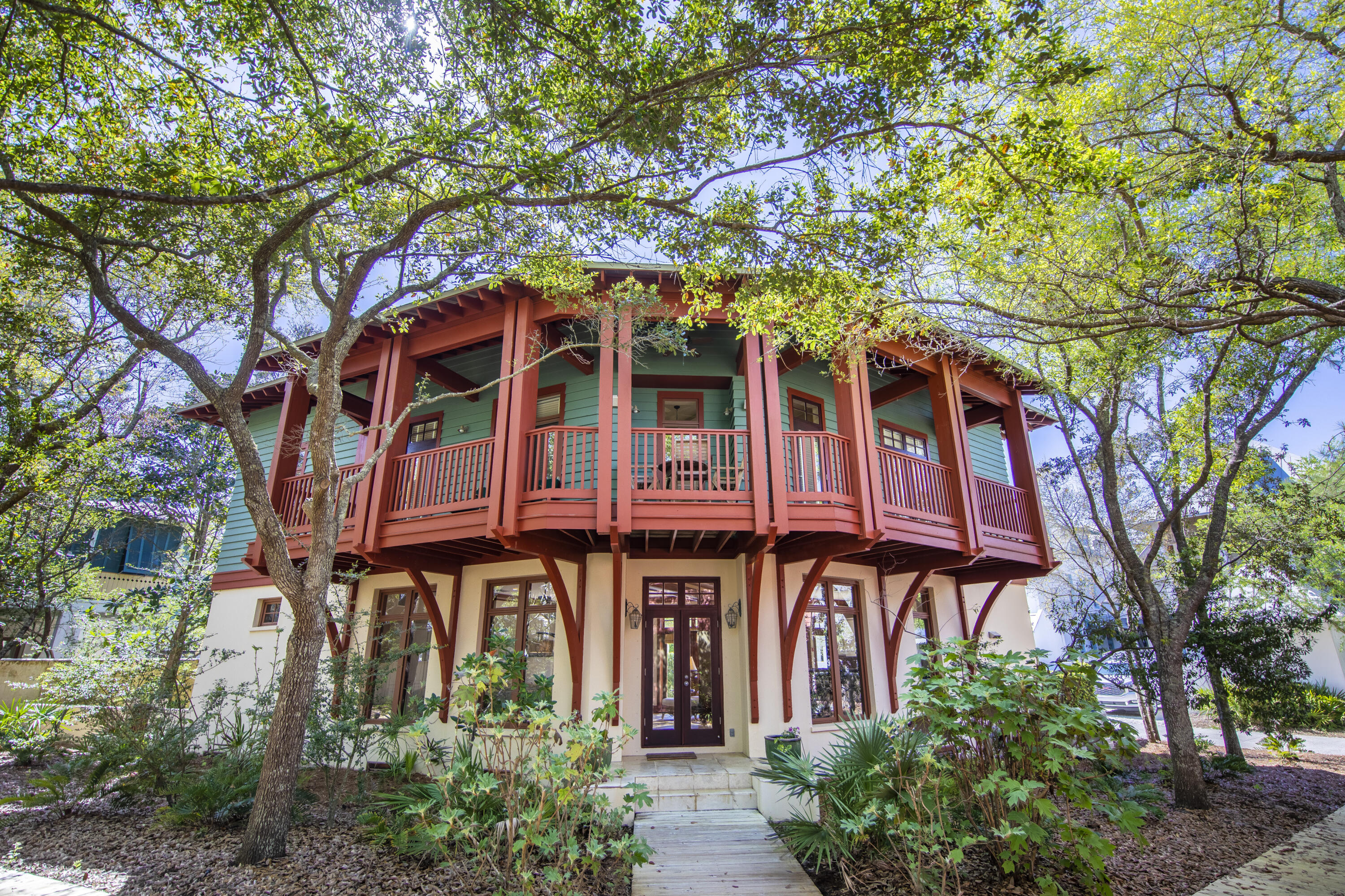 A quintessential Rosemary Beach home located next to the peaceful Triangle Park and just steps to East Long Green. Designed by Kirkland and Assoc. and built by Alana Ficarra, this three-story residence with three bedrooms plus an oversized bunk room, utilizes its location along two quiet boardwalks to maximize privacy - while inside the home it's easy to forget that you are just steps away from all the action of the Town Center! The open floor plan on the first level allows guests to interact seamlessly whether they are enjoying some sun on the back deck, preparing a meal in the kitchen, or socializing in the living room. This first level is flanked by windows, providing a spacious feel and an abundance of natural light. The natural hardwood stairs lead you up to the second floor where you find two large guest bedrooms with a shared jack-and-jill bath, an office space, and the double French door entrance to the Master Suite. A covered balcony perfect for sipping coffee and enjoying the sounds of the fountain below, spans the length of the home and can be accessed from the Master, the office, and one of the guest bedrooms on this level. A spiral staircase takes you to the third-floor kids' haven with a sitting area - the perfect space for a gaming room - and a large bunk room with a full en-suite bath. This home has never been rented and has been impeccably maintained by the original owners. HVACs & water heaters have recently been replaced, there is a whole-home water filtration system, and there are pull-down hurricane shutters in place. Ample storage throughout - two closests on the first level plus a linen closet in the first floor bath; large enterior lockable storage; large walk-in lockable secondary closet in the master; three storage closets on the third level and two large linen closets in the third-floor bath.