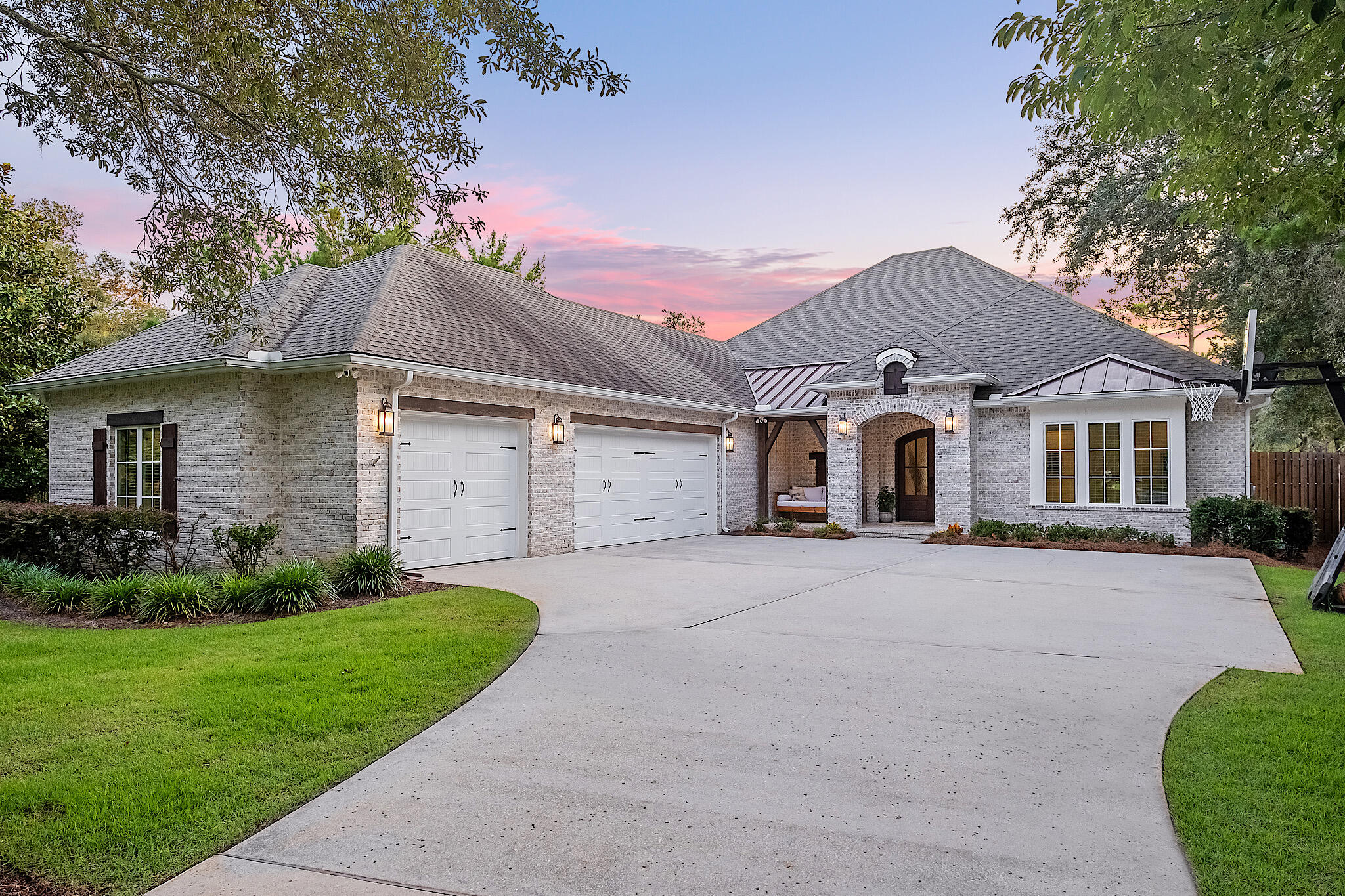Welcome to your dream waterfront oasis! This immaculate 4-bedroom brick home nestled along tranquil Mussett Bayou offers a luxurious and comfortable living experience. With a host of exceptional features and amenities, this property is a rare find.

As you approach the front entrance, you'll be captivated by the timeless elegance of this home's exterior. The maintenance free brick construction not only adds to the property's curb appeal but ensures lasting durability. With a 3-car garage, you'll have plenty of space for vehicles and additional storage needs including an envious workshop for those who like to tinker.

Step inside and be greeted by a spacious and inviting living space complete with wet bar and fireplace.  The open-concept design seamlessly connects the the living room, wet bar, home office, dining room, and kitchen, making it perfect for entertaining guests or enjoying quality family time.

Your gourmet kitchen is a haven for accomplished or aspiring chefs. It boasts top-of-the-line appliances, generous countertop space, a spacious walk-in pantry, and an expansive island that comfortably accommodates six plus nook for casual dining. The entire space offers a scenic vantage point overlooking the pool and bayou, creating a picturesque backdrop for meals. Additionally, a built-in desk area adds convenience, whether you're attending to bills or overseeing a little one's homework while preparing dinner.

The heart of this home lies in its entertainment options. The upstairs dedicated media room provides the ultimate cinematic experience, The pool and hot tub area invite you to unwind and enjoy the picturesque views of the bayou. Imagine relaxing in the hot tub, soaking in the tranquility of your private waterfront paradise, while dinner is prepared in your summer kitchen and the game is playing above the fireplace of the outdoor living room - all in a screened lanai so there are no pesky unwanted guests.

For those with active lifestyles, this property offers more than just water views. A trampoline and playground area ensure endless fun for the young and the young at heart. Whether it's a weekend afternoon with the family or a BBQ with friends, this outdoor space is sure to delight.

When you need a break from outdoor activities, step into the pool bath, thoughtfully designed for your convenience. No need to trek through the house with wet swimsuits - this feature is a game-changer for waterfront living.

With four spacious bedrooms, there's room for the entire family or overnight guests. Each bedroom exudes comfort and style, providing a serene retreat after a day of enjoyment.  The primary suite boasts a private fireplace, dual closets, and a spa inspired bathroom including soaking tub, dual vanities and oversized shower.

This 4-bedroom brick beauty on the bayou is more than just a house; it's a lifestyle. From the serene water views to the entertaining amenities, and the convenience of all bedrooms on one level, this property has it all. Don't miss your opportunity to make this home your  own.  Rarely are homes so superbly maintained with so many features.  161 River Circle truly has it all. Schedule a showing today and experience the epitome of luxury living along the beautiful bayou while still being only five minutes to the beaches of 30A.

Room and lot dimensions are approximate and should be verified by the buyer.