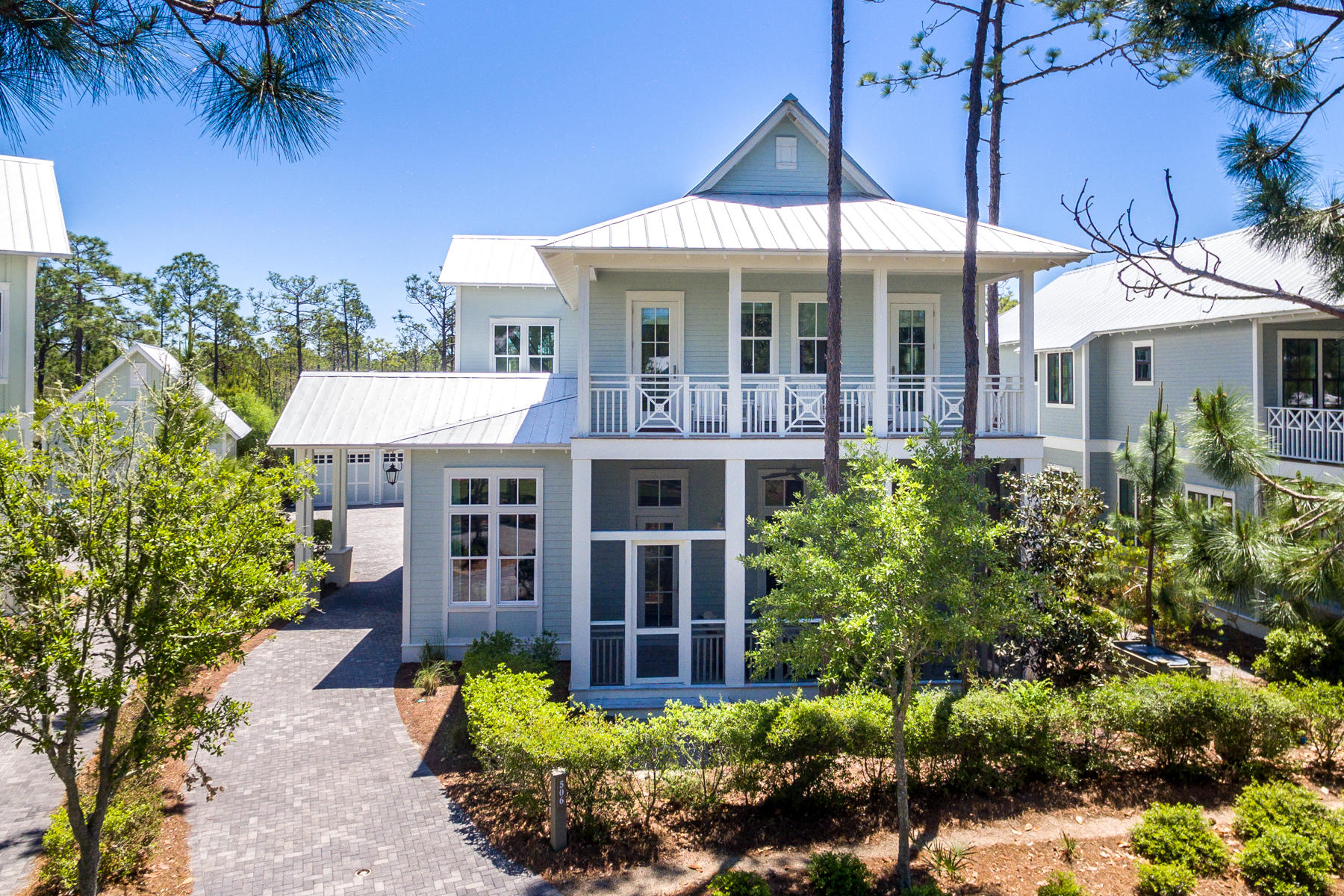 Stunning custom home in the quiet and secluded Cedar Woods section of Watercolor. Custom built by Romair Construction, this home has had only one owner and never been rented. No detail was overlooked in the design of the home, it's finishes & furnishings. The breathtaking open concept great room offers soaring 12' ceilings, abundant windows, a stunning state of the art kitchen & lovely dining area all overlooking the pool & spectacular outdoor living area. The kitchen has white quartz countertops, custom cabinetry, Wolf & Sub Zero appliances including an icemaker & wine fridge. Open the triple set of French doors in the great room and step outside by the pool, relax under the cabana by the outdoor fireplace, enjoy grilling in the beautiful summer kitchen or alfresco dining under.... the stars. 

The first floor is completed with a large master suite, spa like master bath and private porch. The second floor features a second living area with spacious porch, 3 additional guest bedrooms with ensuite baths and a large bunk room. This home has a 2 car detached garage. Watercolor Resort is tucked between the beautiful beaches of the Emerald Coast and Western Lake, a natural 220-acre coastal dune lake. Watercolor is rich in natural beauty and offers stunning amenities including a full service beach club, 5 additional pools, an active tennis center, miles of bike trails and an easy stroll or bike ride into Seaside.