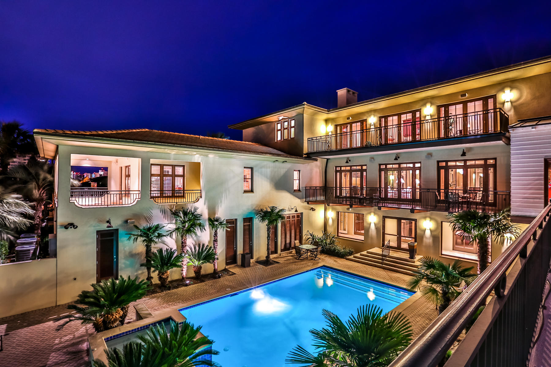 ''Villa Blanco'' not only delivers deep water canal frontage with two 40 ft. boat slips but provides unobstructed views of the Gulf and beach access right across the street. Masterly designed, this 11,913 sq ft, canal-front Holiday Isle retreat offers the best of boating and beaching on the Emerald Coast.The home is built of poured concrete and includes a large canal-front pool with hot tub, cabana, and wet bar. This 7 bedroom, 11 bath home could serve as a family compound or a corporate retreat and will generate over $300,000 in rental income this year. Designed for entertaining, this casually elegant home includes a game room, multiple gathering rooms, two dining rooms and a chef's kitchen with butler's pantry plus serving kitchens on each floor. Must see home for the discerning buyer. With seating for 14, game room with pool table and two TV screens, and home gym.  A complete apartment with separate entry and garage is also on the ground level. With a SubZero refrigerator, 6-burner Thermador gas cooktop, dual ovens, 2 Bosch dishwashers, 2 warming drawers, and large butler's pantry, the main kitchen will delight even the most discerning epicureans. The formal dining room seats 8, while an additional dining room caters to more casual family dinners. A fully equipped wet bar off the main living room makes entertaining easy. The master suite is a true respite with breathtaking views of the Gulf. The his and her baths are well-appointed and each boast heated floors. The master suite includes a private laundry and sitting area. In addition, this exquisite home possesses private elevator access, gas fireplaces, a 4-car garage, 1-car garage for apartment, 7 HVACs, plantation shutters, and lots of storage. Terrazo tile, marble, or cherry hardwoods adorn the floors throughout. Tasteful transitional furnishings convey in sale. Nothing else on the Emerald Coast compares to this luxury home.