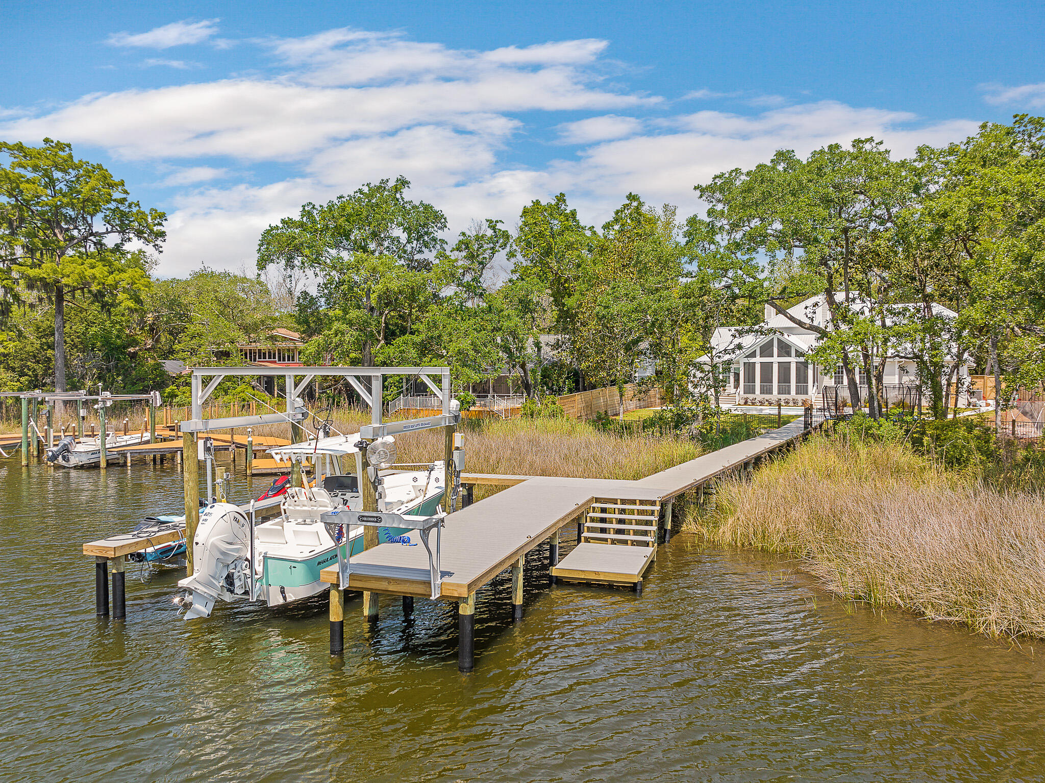 Boating and Entertainer's delight on private street with No HOA on a 1/2 acre of land located near Sandestin & minutes to 30a!This newly built home has 4br/4.5 baths plus bunk room on private street with sheltered water on the popular Choctawhatchee Bay. The large chef's kitchen features a 48''WOLF range, wet bar with built-in wine/bev. & ''Sonic'' style ice maker, an oversized quartz island and a giant butlers pantry. Home has 3 car garage, 3 fireplaces and a large screened in porch. The ground floor master suite features an oversized spa-like bathroom and overlooks the resort style hot tub and pool.Three additional bedrooms with en-suite baths plus bunk room, home gym/storage and media room are located on the second level.Brand new large dock with 16,000lb boat lift, (2) jet ski lifts & a custom "Killer Dock"  fish cleaning station. There is bonus storage space on each level which is a rarity in newer coastal homes. Additional features include but not limited to: Hardwood Floors, Designer Lighting includes: Visual Comfort, Gabby and Serena & Lily, 500lb commercial grade ice maker, mudroom, parking to accommodate up to 10 cars, vaulted ceilings, built-in bookshelves, oversized butler's pantry, resort style heated and chilled pool with lap pool lane and large hot tub/spa, screened in porch with gas lines and venting in place for the outdoor kitchen of your dreams overlooking the bayou and sportsman's dock.***To be noted..Interior renovation and additions include but not limited to: 7" wide white oak hardwood floors throughout the home, complete interior re-paint job, powder room with new designer wallpaper, vanity & marble floors, master bath renovation includes new marble floors and hand glazed tile shower. All new cabinet hardware and new plumbing fixtures throughout, addition of commercial ice maker and extra refrigerator in garage, new shiplap accent walls, all new lighting & mirrors installed throughout the home, new fireplace surrounds with marble, shiplap and pecky cypress mantels, brand new hand glazed tile backsplash in wetbar and kitchen with new pot filler installed, new custom built shelving in garage, privacy fence installed around property, gutter system, circular paver driveway added, new landscape design, Ring Camera surveillance and alarm system, Sound equipment inside and outside ,custom window treatments & blinds added throughout the home, as well pool/ spa addition completed with a dock and boat lifts. Furniture, boat and jet skis are available at an additional cost.