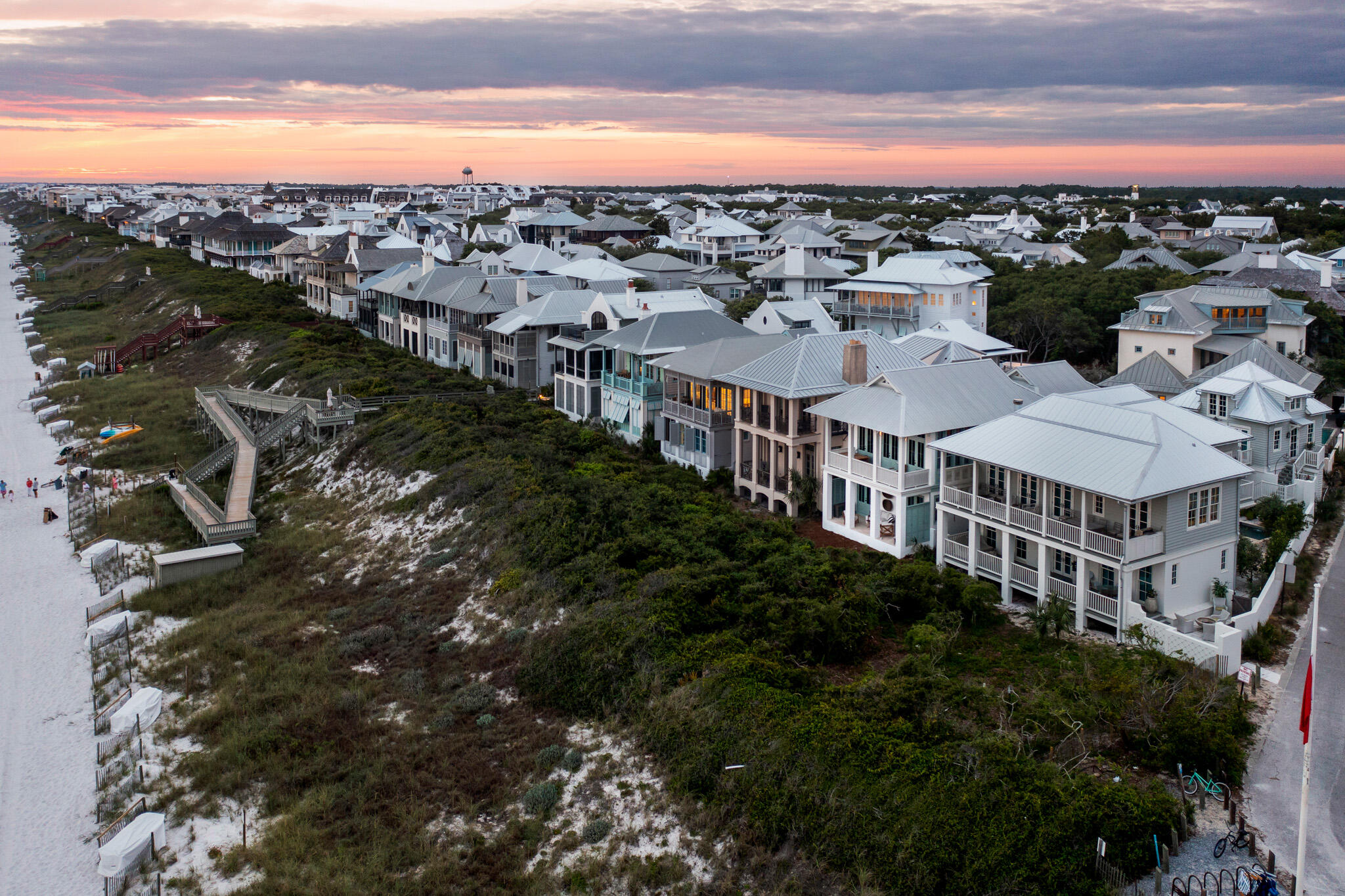 Welcome to your home in Rosemary Beach, where luxurious coastal living meets breathtaking Gulf-front views. This magnificent property has undergone a complete renovation, meticulously crafted and fully furnished by the renowned Ashley Gilbreath Interior Design. With its prime location, you'll enjoy unparalleled convenience and access to the best that 30A has to offer. Step outside your door and immerse yourself in the vibrant atmosphere as you take a leisurely stroll or bike ride to the finest restaurants and shopping destinations in the area.
The main house boasts three bedrooms, 2 on the first level and one on the second, providing ample room for relaxation and privacy. Additionally, there are charming bunks, perfect for accommodating additional guests or creating a cozy nook for children. Every inch of the main house has been thoughtfully designed and tastefully finished to create a harmonious blend of coastal elegance and modern comfort.
You and your guests will also enjoy gulf views from the carriage house, creating an idyllic retreat for guests and family. This one-bedroom oasis offers a tranquil sanctuary where the sound of the waves will lull you into a state of relaxation.
Whether you're savoring panoramic sunsets from your private balcony, entertaining in the spacious living areas, or unwinding in the meticulously designed bedrooms, this Gulf-front haven ensures that every moment spent here is filled with tranquility and beauty.
Don't miss the opportunity to make this exceptional Rosemary Beach property your own. Immerse yourself in the coastal lifestyle, where sun, sand, and sophisticated living converge in perfect harmony.