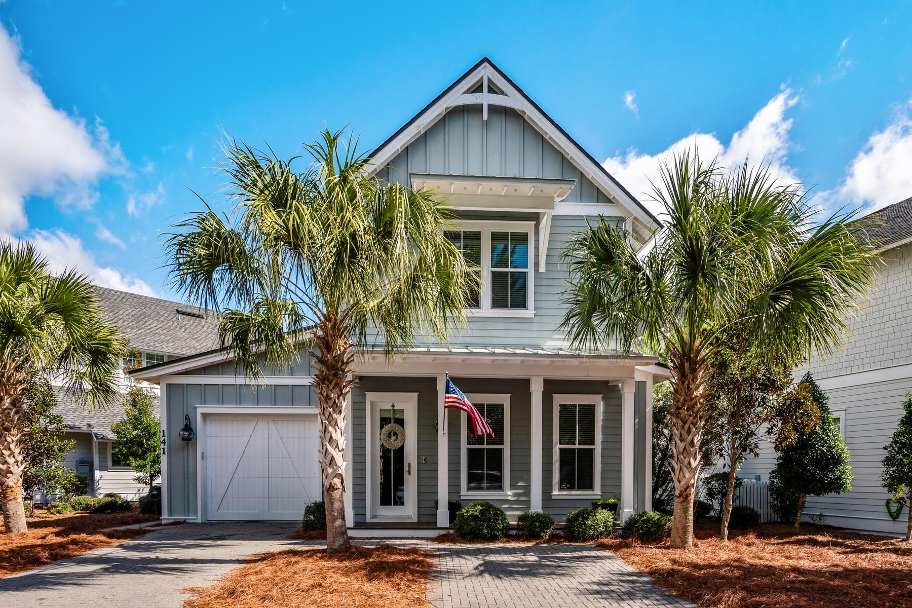 Whether you approach this wonderful house from the front or back, you'll be charmed and surprised. Stepping into the front door envelopes you in a warm open space with three-quarter high shiplap walls, hardwood floors, quality workmanship and white trim accenting a soft gray interior. If you slip through the white picket fence in the back, you'll arrive at the door to the screened porch. This lot is larger and more private than many for its curved boundary on the street circle offering added privacy. The home features abundant high quality materials and fixtures plus attractive, very low maintenance landscaping. The kitchen is a classy space with marble counters, stainless steel appliances, farmhouse sink and crisp white cabinetry. Tall windows flood the living space with natural light. There is a master suite on both first and second floors, plus two other guest rooms, four bathrooms, laundry room and garage. The residence is ideal for investment, retirement, full-time residence or vacation home. The pearl white sandy beaches and emerald green Gulf of Mexico waters, along with shopping, dining and entertainment, are all near. And after time in the sun, at the pool or a bike ride to shops, you'll pedal a little faster to return to this special, quiet haven.
