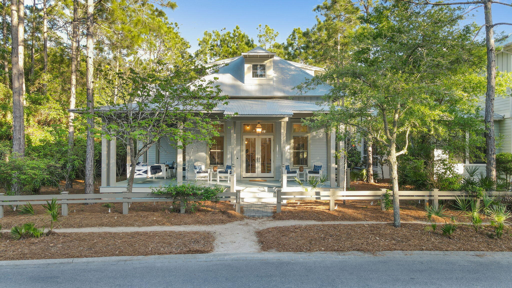 Welcome to your exquisite l 4 bedroom, 4.5 bath home located on an oversized lot nestled among the tall pines next to one of Watercolor's nature preserve in the Forest District. Entertain family & friends on the wide front porch or just relax on the swing and watch for fox and deer to appear early in the morning. Featuring a perfect floorplan with a large kitchen open to the living and dining room. Two of the four bedrooms are downstairs as well as a reading nook that opens on to the oversized back screened porch perfect for relaxing in the pines. Continue up the stairs to a fun loft and two bedrooms each with their own baths. Beautiful natural surroundings and nature filled grounds surround this well kept, turnkey, fully furnished home. Enjoy the 9 pools and private beach.