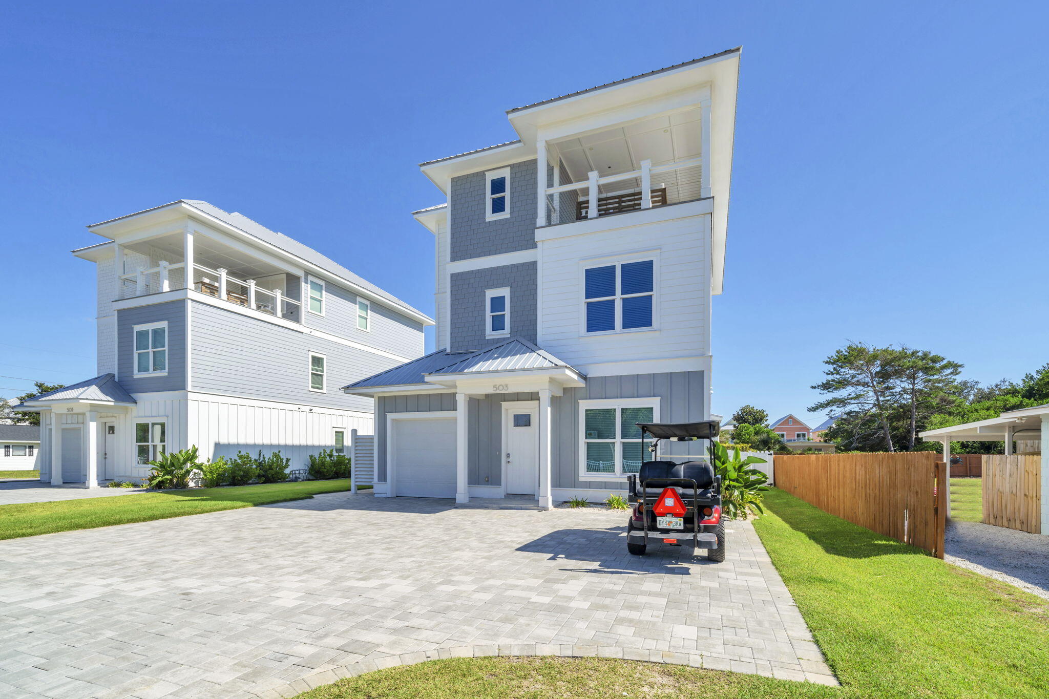 Crafted in 2023 with a flawless eye for coastal elegance, this three-story residence in Bid-A-Wee Beach elevates beach living with both sophistication and ease. Just a block from a private, deeded beach access, the home offers sweeping gulf views, proximity to the lively Margaritaville Resort, and a lifestyle that seamlessly balances relaxation with entertainment. The home spans eight bedrooms and seven-and-a-half baths, thoughtfully designed for multi-generational families or large groups. On the first floor, a king suite provides accessible comfort, while the upper levels host expansive bedrooms with cozy sitting areas and individual TVs. The third-floor family room is a retreat of its own, complete with coastal furnishings, an oversized sectional, and foosball for laid-back evenings. At the heart of the home lies a chef-inspired kitchen with GE Café appliances, quartz countertops, and custom woodwork. Open living and dining spaces create effortless flow, ideal for gathering and celebrating. Dual washer and dryer sets add convenience for extended stays, while a garage and drive accommodate up to seven vehicles. Outdoors, the resort atmosphere continues with a heated saltwater pool featuring a slide, a summer kitchen, and ample patio space for lounging and alfresco dining. Ping pong and basketball keep every age entertained, while the neighborhood's beach gate at the end of Albatross Street ensures the shore is always within reach. With short-term rentals permitted and gross rentals of $250,000 annually, this property is as much an investment as it is a retreat. Offered fully furnished and turnkey, it stands ready to deliver unforgettable coastal experiences just minutes from 30A and the best of Panama City Beach.