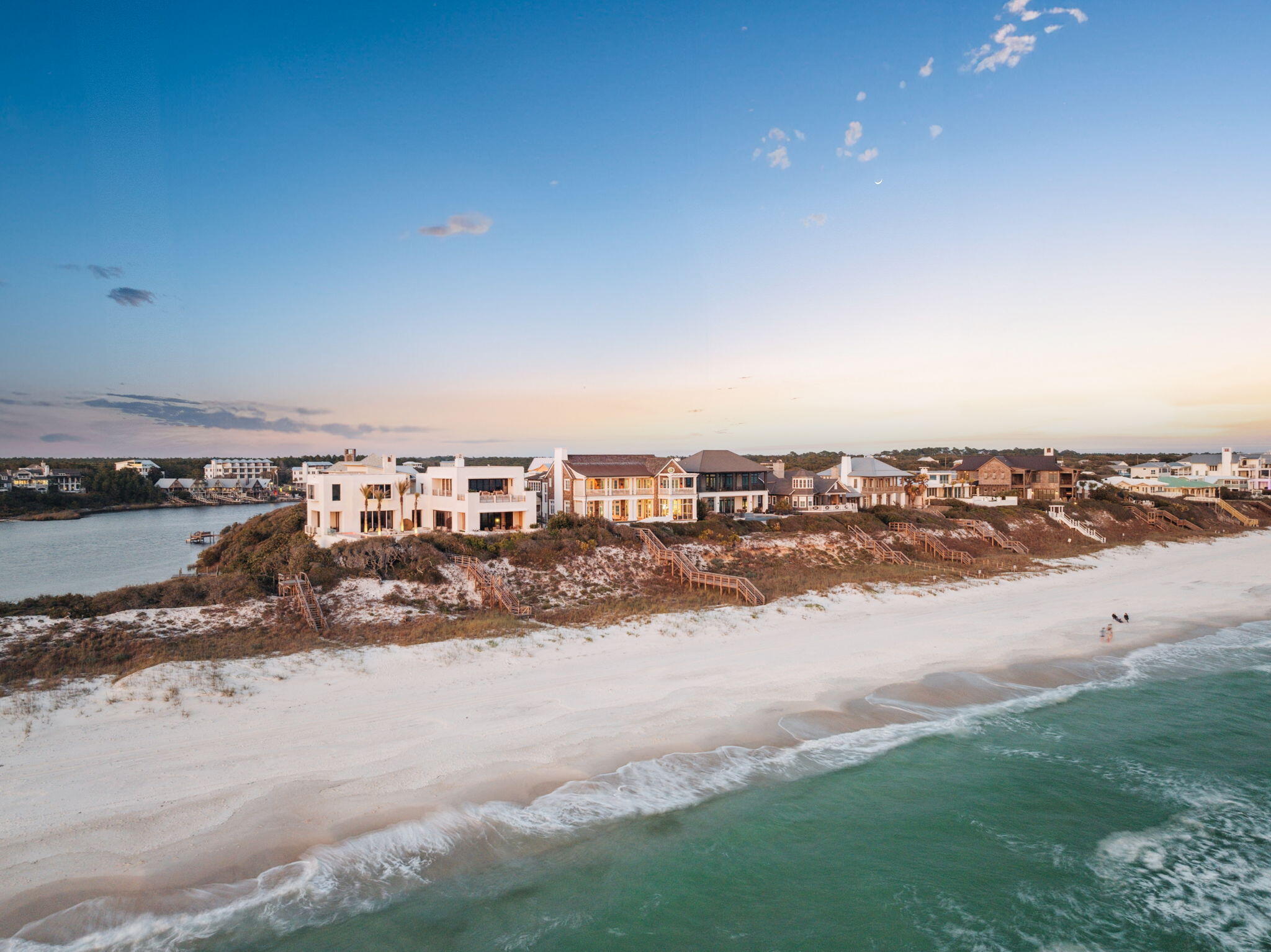 Located at 96 Camp Creek Point Drive in Inlet Beach, Florida, this exceptional beachfront residence offers a harmonious blend of modern elegance and timeless charm. Designed by renowned architect Geoff Chick and constructed in 2020, the home spans 6,259 square feet on a 0.17-acre lot, featuring six bedrooms and seven and a half bathrooms.

The home's robust all-concrete construction is complemented by cedar shake siding, seamlessly integrating with its coastal surroundings. A decommissioned brick paver driveway, sourced from Charleston, South Carolina, leads to a two-car garage and a distinguished second-floor entryway. Inside, the open-concept living, dining, and kitchen areas are adorned with reharvested ceiling beams from Ohio and shell stone flooring, creating an atmosphere of sustainable elegance. The gourmet kitchen boasts solid Taj Mahal quartzite counters, premium Sub-Zero appliances, a Viking range, and a metal island with an integrated sink and bar seating. Custom Waterworks fixtures and modern flat-front cabinetry further enhance the space.

Each bedroom is thoughtfully designed with features such as automatic blinds, custom grasscloth wallpaper, and ensuite bathrooms equipped with paneled linen closets and hand-painted Mackenzie-Childs accents. The master suite serves as a private sanctuary, offering a vaulted ceiling, silk-stitched wallpaper, a marble bathtub, dual marble vanities, and a private gulf-front balcony.

The residence includes a standalone suite over the garage, reminiscent of a charming carriage house, complete with a full ensuite bath and bunk beds. Pet-friendly features are integrated throughout, including a dedicated dog room with a Dutch door, a hidden dog gate, and a dog-washing station with a quartz sink.
Designed for both relaxation and entertainment, the home features a spacious media and game room, perfect for gatherings. This thoughtfully curated space includes plush seating, a large-screen display, and built-in surround sound, offering a cinematic experience from the comfort of home. A ping pong table and custom cabinetry further enhance the room's functionality, making it an inviting retreat for both kids and adults alike.

Outdoor spaces are equally impressive, featuring a gulf-front pool with a shallow shelf suitable for pets, a spa with a waterfall feature, and a screened porch with an outdoor kitchen. A private Trex boardwalk provides direct access to the pristine beach.

Modern conveniences include a tankless hot water system, multiple laundry areas, a private elevator, whole-home automation via Crestron, whole-home audio, and over 2,000 square feet of climate-controlled storage.

This property epitomizes coastal luxury, offering an unparalleled living experience in the coveted Camp Creek Point neighborhood, just minutes from Scenic Highway 30A's array of shopping and dining options. Inquire today to schedule a showing.