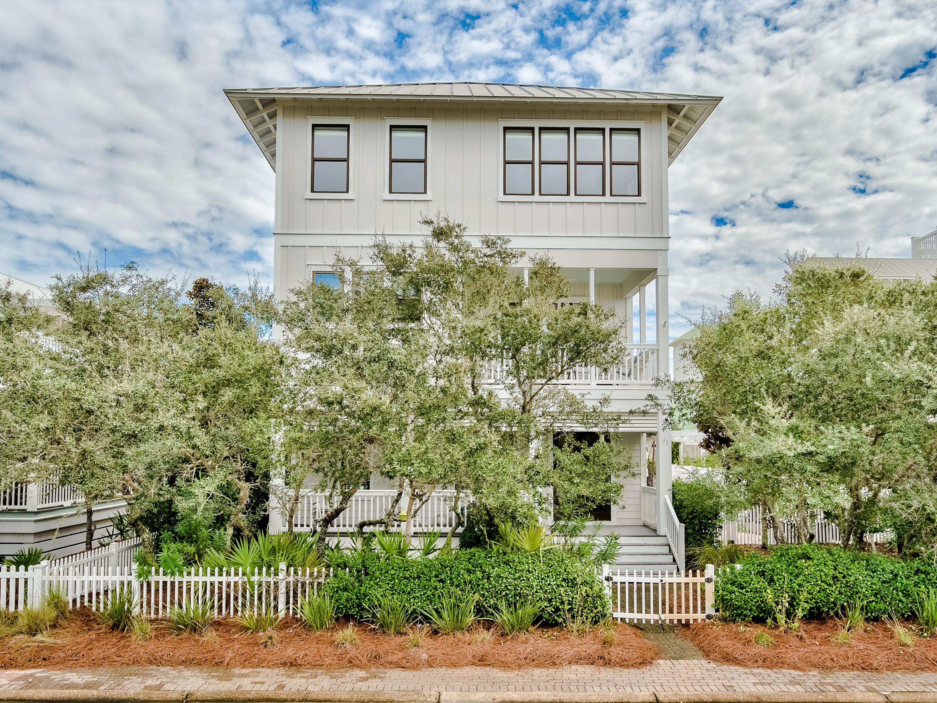 Enjoy a private heated pool and gulf views from this never-rented three-story home in the gated, gulf-front neighborhood of Old Florida Beach. Inside this four-bed, four-and-a-half-bath retreat is an incredibly spacious floor plan and an elevator that provides access to the second and third floors. The first floor of the home features a flex space that could be used as a sitting room, recreation room or bedroom, as well as a spacious laundry room and full bath conveniently situated near the pool. The second floor is designed for daily living with an open kitchen, dining and great room as well as a balcony perfect for enjoying the scenery with morning coffee. The third floor encompasses an owner's suite, sitting area with French doors, additional bedroom. Notable enhancements to this home include 10-ft. ceilings on all levels, abundant storage, wide-plank oak floors throughout, two energy-efficient A/C units, two water heaters with timers, spray foam insulation in the roof and on the first floor, sound insulation between floors and around select interior walls and a seamless metal roof. The home, being sold fully furnished, also includes impact and Low-E glass doors and windows, a hurricane-rated and insulated garage door, Trex decking on exterior porches and balconies, an ADT security system and an intercom system. A two-car heated and cooled garage with workspace and a sink offers true luxury at the beach, with three additional parking spaces outside. Professional landscaping, an irrigation system with dedicated well, and an oversized paver patio complete the exterior space. Though never rented, this home's gulf views and close proximity to the beach access could make a lucrative rental opportunity, with projections of more than $220,000. 

Old Florida Beach offers three private beach accesses as well as a dock on Draper Lake, beach boardwalk, gazebo and community heated pool.