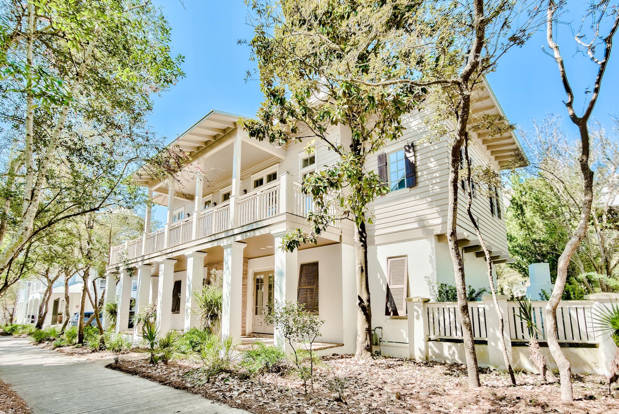 This beautiful New Orleans style beach home is a must see for anyone looking for all the best Rosemary Beach has to offer with close proximity to Main St and the beach boardwalk. This gem of a home is beautifully maintained and has never been rented. With 5 bedroom and 6.5 bath there's plenty of room for the entire family to enjoy the home featuring a stunning private courtyard with a large pool and pool deck, outdoor shower, covered deck area, and a relaxing fireplace area. Opening to the courtyard is the den/bonus room (which could also be a 6th bedroom) with a new wet bar and a full bath. Also on this first level of the home you will find a Master suite, with a spa like bathroom and large walk-in closet, another large bedroom with en-suite bath, and the convenient laundry area. The home's 2017 renovation enhanced the home with the addition of an elevator, kitchen remodel, half bath addition, new metal roof, upgraded HVAC, tankless hot water heaters, and an interior bridge connecting the carriage house to the main home, which added 232 sq. feet to the now 4,129 sq ft home.
Access the second level of  the home via the elevator or lovely staircase where you find a large open living room and dining area with high coffered ceilings and a large fireplace. The updated Chef's kitchen offers an oversized island, stone counter tops, stainless steel appliances, double ovens, farm sink, ice maker, and wine refrigerator.  In addition to a powder room on this level, there is also a generous full bathroom with double sinks, and a large separate guest bedroom with two queen beds.  Also on the second level, the former carriage house is now a fabulous Master Suite seamlessly integrated with the main home. This Master suite offers a luxurious master bath with a separate tub, dual vanities, a walk-in closet, private balcony, and a separate entrance.
The third level of the home provides an additional guest bedroom with wet bar, a full bath with large Jacuzzi tub, and a built-in office space.  Also located on the 3rd level are the stairs to access the Widows Walk where you can enjoy the sunset and a breathtaking panoramic view of the incredible Gulf.