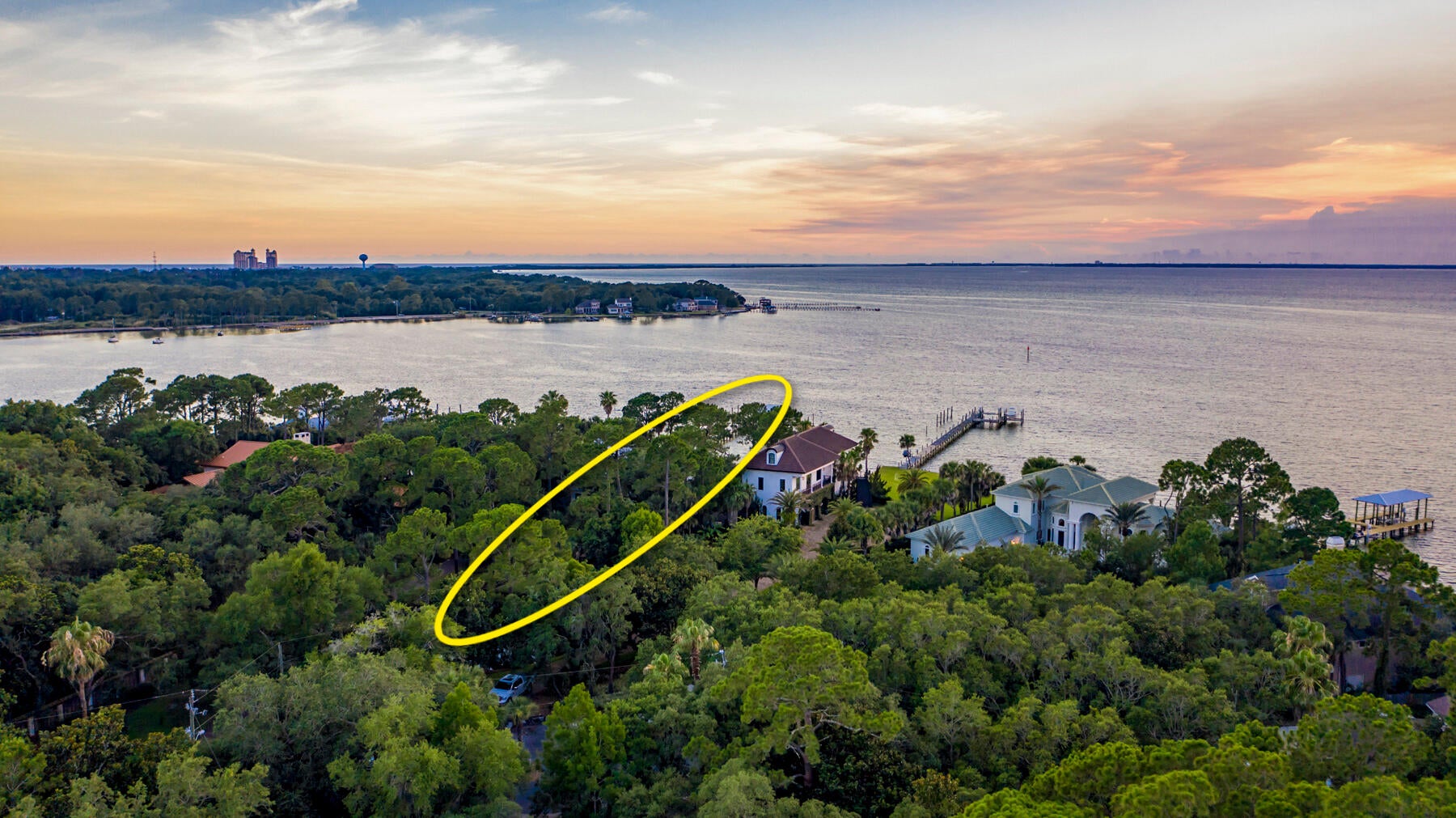 Stunning Estate-Sized Property located on the Private, Exclusive Street known as Bambi Drive of Cobb's Point, oriented on 165' of deep-water water at the point of Joe's Bayou and the scenic Choctawhatchee Bay of Destin, Florida. This Caribbean-inspired home showcases a fabulous and expansive water view corridor from its primary living area, including the kitchen and dining room. The sunsets are breathtaking!  This home features solid wood floors, granite kitchen countertops, wet bar, wine cooler, and an ice maker in the living room.  The master bath contains a Jacuzzi tub, walk-in shower, and Caldera Spa.  The Sonos surround system provides indoor and outdoor listening capability.  The pricing of this opportunity is of profound value for simply the lot if it were vacant, thus a.... knockdown and redevelopment could be justified should you be interested in customizing a new home.  Nonetheless, the current home can be enjoyed as it stands, and would make a perfect getaway from the hustle of metropolitan life, especially considering convenient access to Destin Executive Airport (DTS), only 10 minutes from the driveway of this gorgeous, irreplaceable estate.  Please inquire for further information and to schedule a private showing.