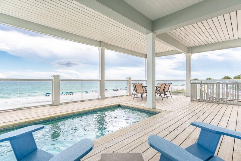 ''Sea Salt'' is a Gulf-front dream home located on the West end of Panama City Beach. It features 6 bedrooms, 6 full and 2 half bathrooms, and will sleep 20 people. It features a private heated pool and direct access to the beach.
The first floor features a second living area with a Queen-sized sleeper sofa and flat screen TV. Keep walking back and you will see a kitchenette with a second refrigerator, half bathroom, and a door leading to the outside deck area.
On the second floor you will find a great open floor plan with a fully stocked kitchen, dining area with seating for 10 guests, and a cozy living room with a flat screen TV. Enjoy all this space while looking out the full windows and glass doors at the beautiful Gulf of Mexico. On the second floor outside deck, you will find the pool and a lounge seating area perfect for watching the waves and relaxing. Down the hall there will be a half bathroom and two bedrooms with en-suites. One bedroom features a Queen over King bunk bed, a flat screen TV, and the connected bathroom has a tub/shower combination. Across the hall is a King sized bedroom also with a flat screen TV and a walk-in shower.
Head up to the third floor and you will find enough sleeping for twelve. On the north side of the home there's a King-sized bedroom with a tub/shower combination in the connected bathroom and across from the hall is a Queen over King bunk bed room. Just outside this bedroom is a full bathroom and a Twin bunk bed nook, each with its own flat screen TV overhead. There are two master bedrooms, one Queen and one King, on this top floor that will make you not want to leave the home. Each room has its own personal bathroom, a flat screen TV, and best of all, direct access to a furnished glass balcony overlooking the ocean. The master suite, specifically, features a large bathroom with a double vanity and large walk-in shower.