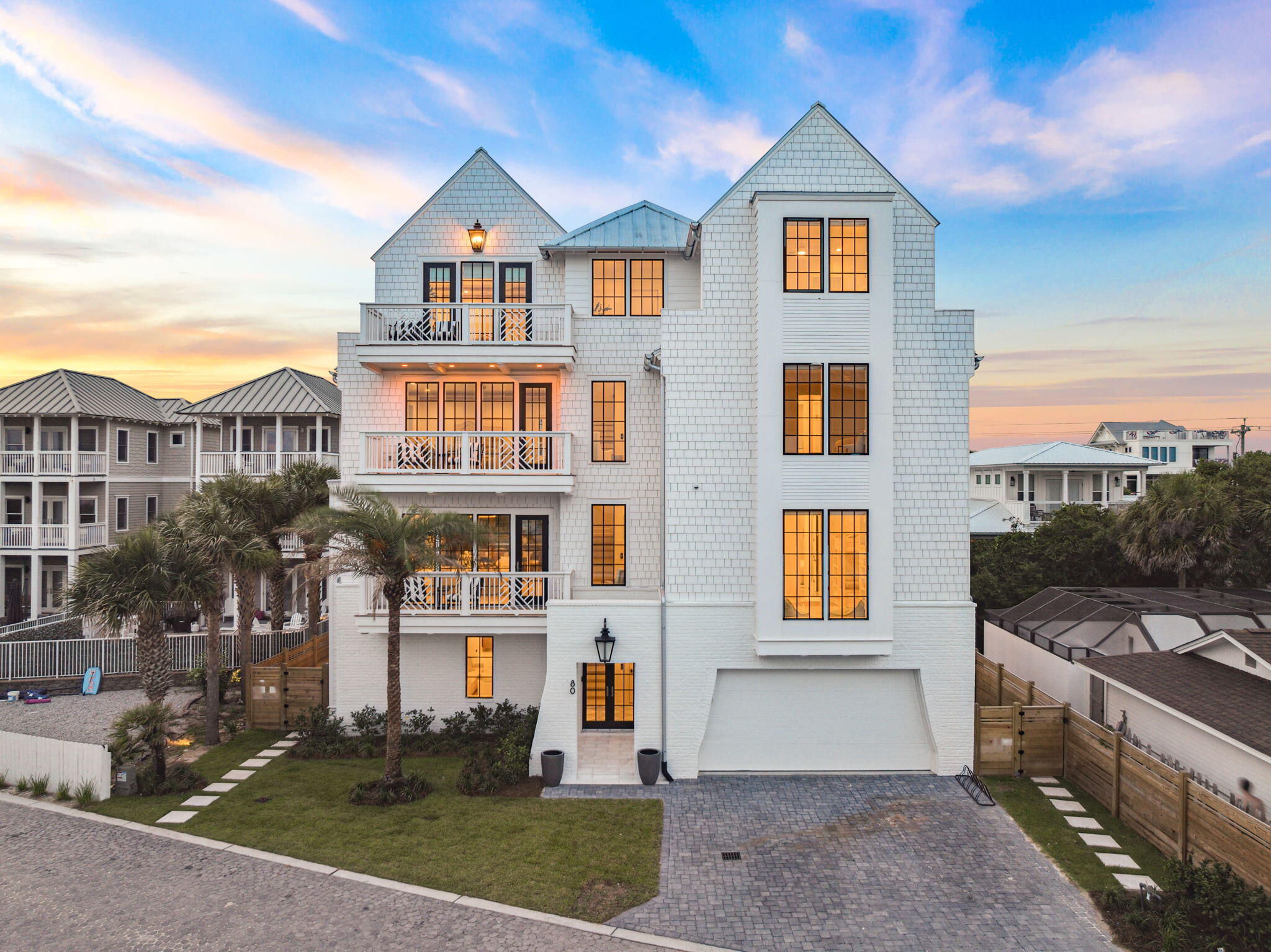 Introducing this newly built coastal estate on Green Street. With over 6,000 square feet of thoughtfully designed living space just one row off the Gulf. Featuring nine bedrooms, seven full bathrooms, and two half bathrooms, the layout is ideal for entertaining, hosting, or everyday comfort.

The first floor features a spacious rec room with a wet bar and lounge area that opens to a private courtyard with a heated pool, outdoor shower, fireplace, and built-in grill. Also on this level are a guest bedroom with full bath, powder room, and a second laundry room complete the floor.

The third level features two guest bedrooms with a connecting bath, a spacious bunk room with its own full bath, and a secondary living space that opens to a Gulf-view balconyperfect for casual gatherings or quiet retreats.

The fourth floor offers three private bedroom suites. The primary suite is a true retreat, featuring an expansive Gulf-facing balcony, oversized walk-in closet, and a spa-like bathroom with soaking tub and glass-enclosed shower. Two additional bedrooms on this level include ensuite baths, one with its own private porch.

Additional highlights include an elevator servicing all four floors, engineered white oak hardwood flooring throughout, multiple covered balconies, and a located within a gated community with private deeded beach access. Just south of 30A and minutes from the area's top dining, shopping, and beach access points, this home offers an unmatched coastal lifestyle.

Whether you're looking for a full-time residence, second home, or luxury investment property, 80 Green Street delivers exceptional design and location in one of 30A's most desirable beachside communities.

All information and dimensions to be verified by buyer.