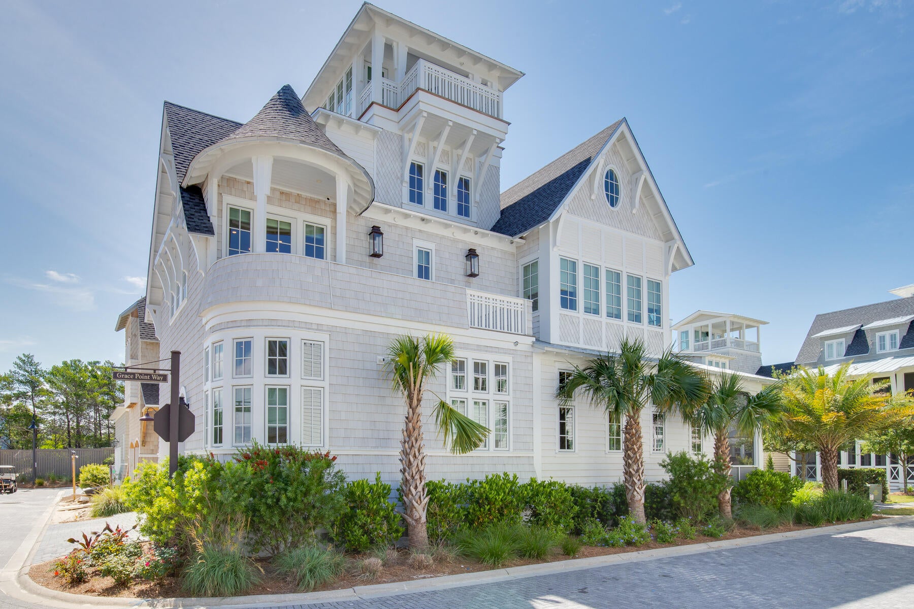 Designed by well-known architect Rick Lowe, this fully-furnished 4 bedroom, 5-1/2 bath home offers grand living in the magnificent setting of Grace Point on 30A. Boasting a balanced blend of coastal chic, wood tones, the layout, and flow of the home is both welcoming and timeless for friends and family to enjoy. Upon entry to the residence, the overhead hand-hewn beams will captivate your attention, as you step onto the warm hardwood flooring, your eye is drawn to the shiplap walls, custom built dining table and cozy sectional that is covered with natural sunlight. The gracious great room offers seating for family gatherings and entertaining and the outdoor living becomes seamless with large doors opening to the wide screened-in porch. Surrounding the large center island, Subzero and Wolf.Each bedroom offers a retreat from your long days at the beach with spa-like baths for refreshing the body and soul while surrounded by Carrera marble countertops and tile backsplashes. 
Notable features of the home include: In addition to the 4 bedrooms, there is a 3rd-floor bunk room (sleeps 10