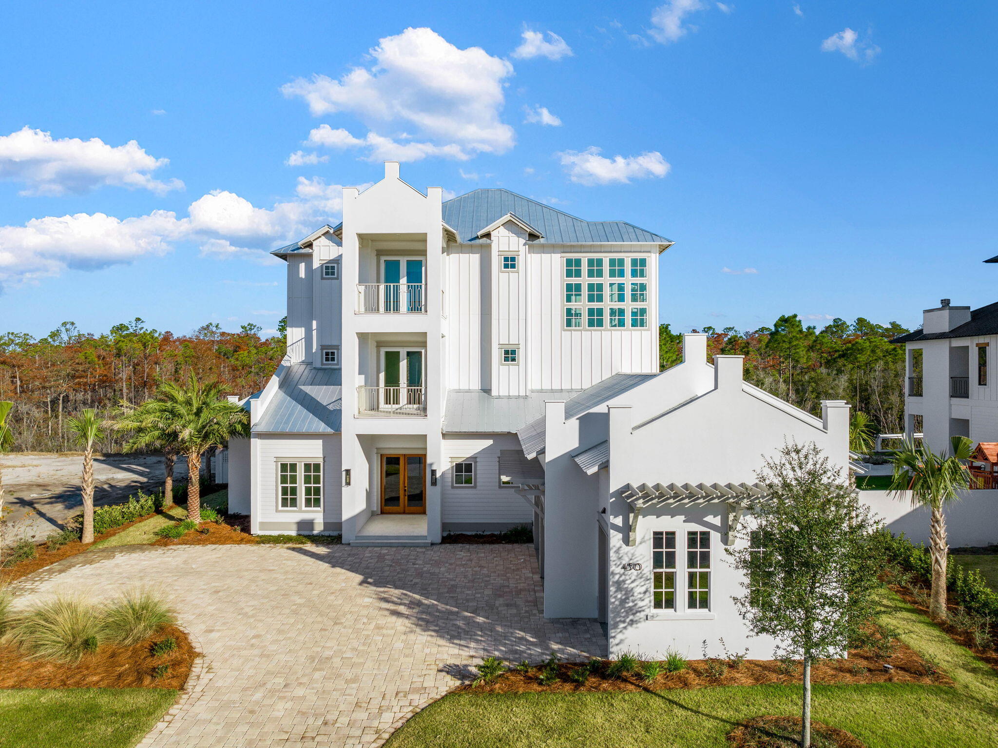 Discover an exquisite architectural masterpiece designed by the renowned John Williams, discreetly nestled behind the private gates of Camp Creek. This luxurious residence embodies impeccable craftsmanship with a tasteful coastal influence throughout.
Culinary enthusiasts will delight in the dream kitchen, featuring custom milled cabinetry, a generously sized island, Brazilian Natural Stone countertops, and a top-tier appliance package, including a gas range. The expansive living and dining areas seamlessly connect to the kitchen, offering direct access to a covered porch with an outdoor kitchen, blurring the boundaries between indoor and outdoor spaces and creating a true extension for living and entertaining.
Strategically situated on the first level, the primary suite overlooks the pool and boasts a spa-like ensuite with dual vanities and a beautifully tiled wet room. An additional bedroom with its own private ensuite completes the first floor. The second and third levels host spacious bedrooms, each with ensuites and private covered balconies, providing the perfect vantage point to savor the mesmerizing hues of the famed Emerald Coast sunsets.
450 Windsong Drive also includes a WaterSound Club Membership, granting access to the exclusive private beach club and some of the area's finest golf courses, such as Camp Creek, Sharks Tooth, Origins, and the planned Davis Love course. This rental-restricted community features a newly constructed amenity center with dual pools, a lazy river, pickleball courts, tennis courts, a wellness center, and an on-site restaurant.
Ideally located between Scenic Highway 30A and Highway 98, the WaterSound Camp Creek community offers convenient access to the iconic town centers of Alys and Rosemary Beach, as well as a wide array of world-class dining and entertainment options along 30A.
Just across Highway 98, the WaterSound Town Center hosts events like a weekly Farmer's Market and provides a variety of amenities, including a Publix, restaurants, a STEAM school learning campus, and medical offices.
Discover today why WaterSound Camp Creek stands as one of the most coveted ownership opportunities along 30A, appealing to both full-time residents and those seeking a second home in this remarkable coastal community.