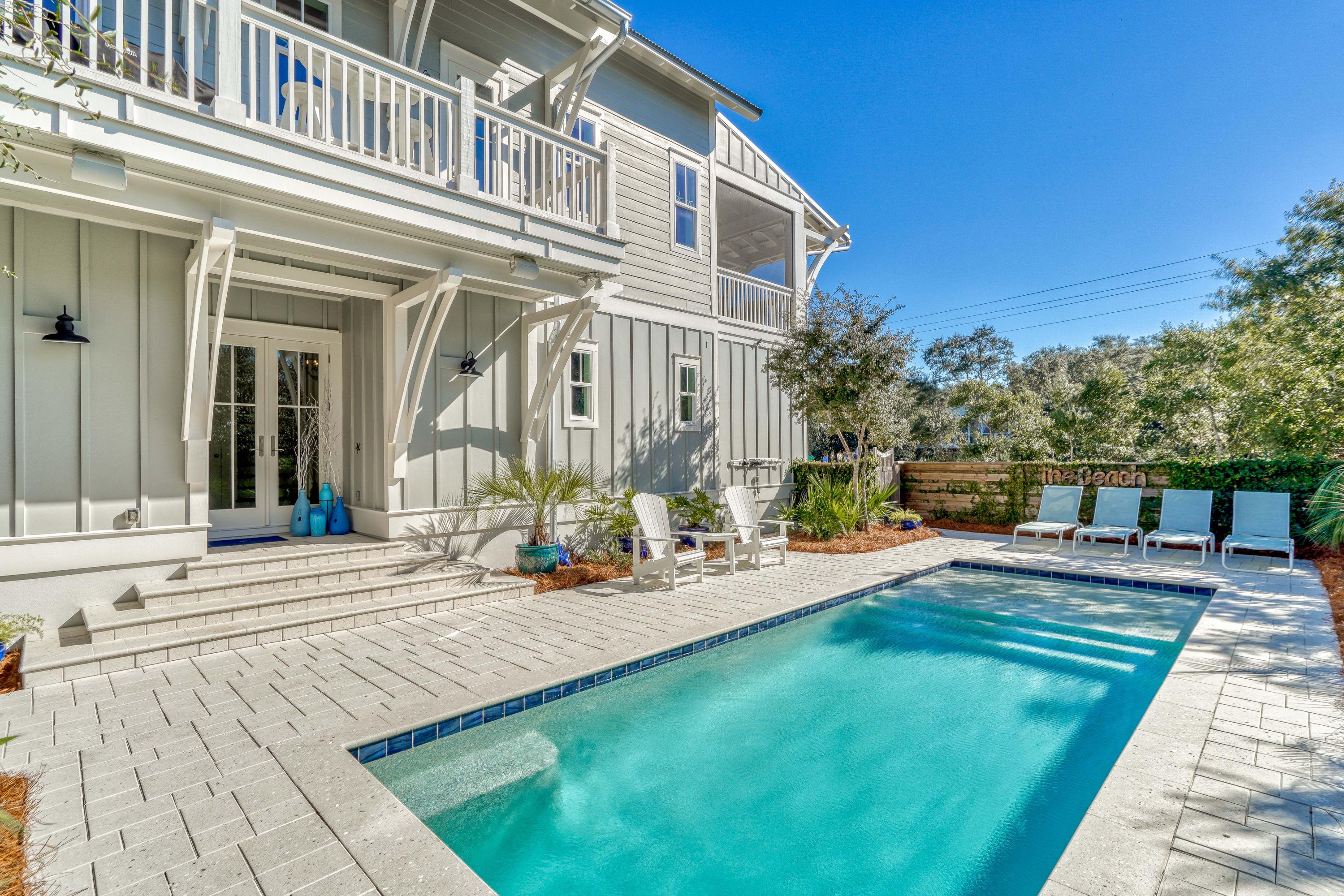 Superior Construction! Huge Lot! This 5 Bedroom home is placed on a large lot with a private courtyard full of mature scrub oaks and vegetation with a private pool to create the perfect Seagrove retreat south of 30A. It is a short walk from 3 public accessses.  A 672 square foot garage with 2 storage rooms, and a fenced 40 ft pavered side yard which will accommodate a RV or boat and trailer along with a large pet area are just a few of  all that is special here.
High end trim and finishes throughout, wire brushed walnut floors, an elevator, and vast amounts of storage. This home was designed to live in!  There are 2 living areas, one large screened porch and a  grilling deck. Ask for our list  of special features. It is extensive! This home must be viewed to be appreciated!