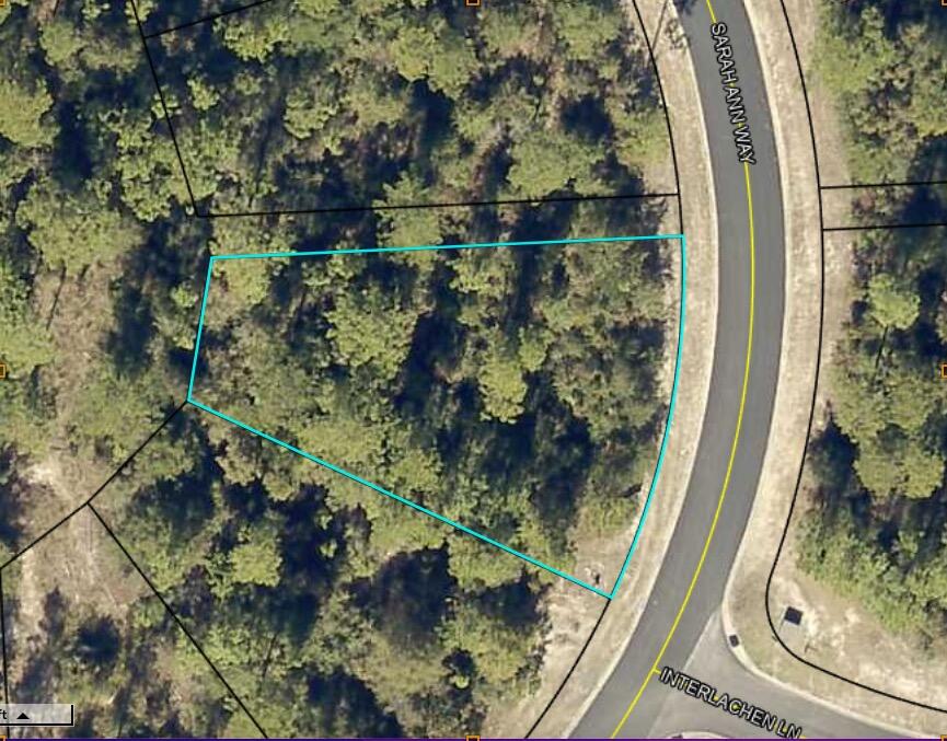 Build your dream home!  This .36 acre lot is located in Heritage Plantation.
This lot has a wooded common area behind and on one side of it.   Heritage Plantation has  sidewalks, green spaces, and ponds, and is   convenient to Crestview for shopping and entertainment.  Make this neighborhood your home! Buyer to verify all information.