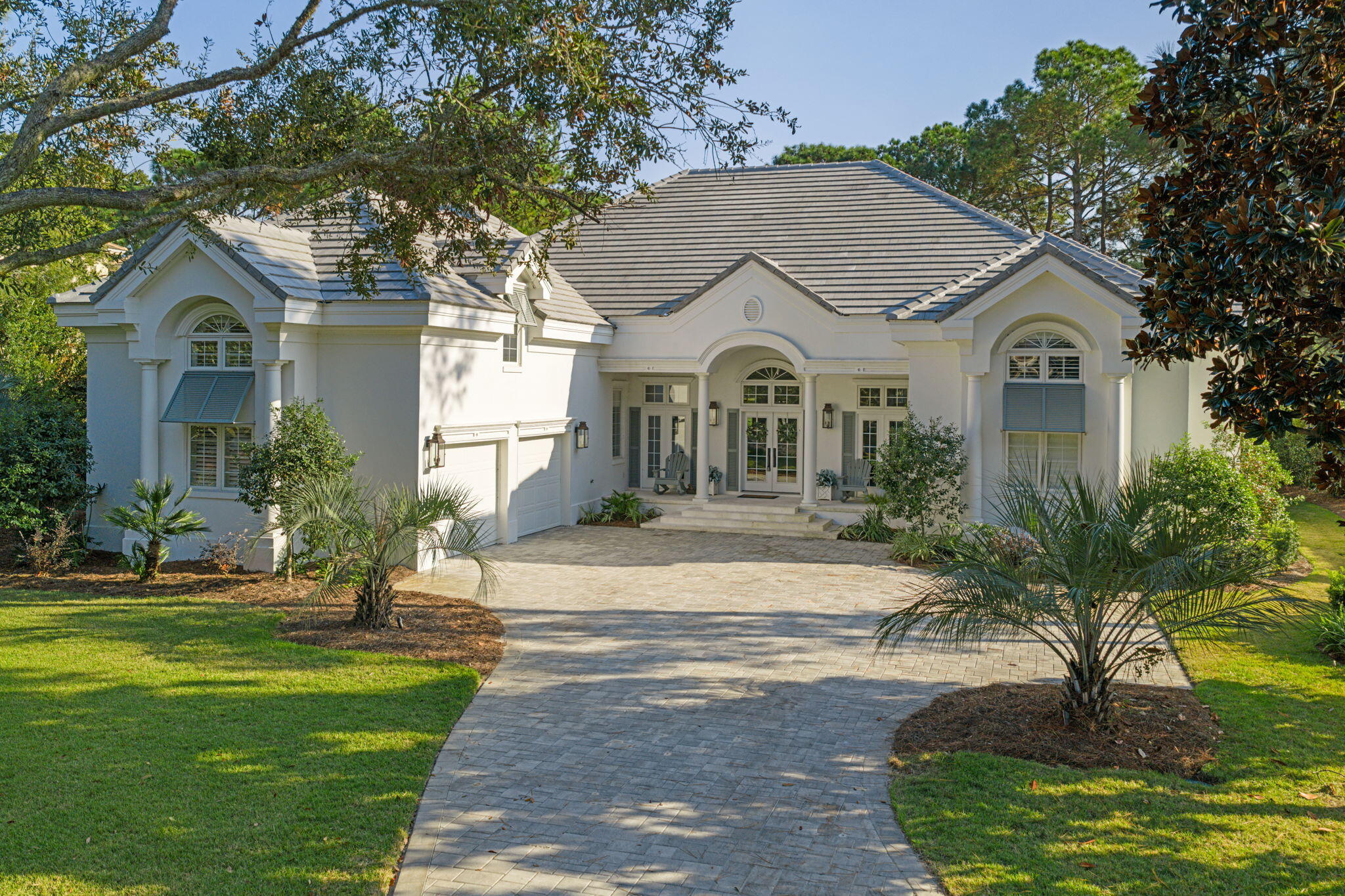 Elegant Coastal Retreat in Burnt Pine - Where Timeless Craftsmanship Meets Modern Luxury.
Welcome to 3284 Burnt Pine Lane, an exquisite residence nestled within the prestigious Burnt Pine community of Sandestin Golf & Beach Resort. Set amid lush landscaping and serene surroundings, this home masterfully blends refined design, quality craftsmanship, and effortless comfort—offering the ultimate coastal lifestyle along Florida's Emerald Coast.
Step inside and be captivated by the attention to detail throughout. The open floor plan is filled with natural light and framed by large windows that invite in views of the surrounding greenery. The spacious great room provides an ideal gathering space, anchored by a custom fireplace and soaring ceilings that enhance the home's sense of openness and elegance.
At the heart of the home lies a chef's dream kitchen, designed for both function and beauty. Outfitted with premium Thermador appliances, including a six-burner gas range with griddle, the kitchen provides restaurant-quality performance for culinary enthusiasts. Dual pull-out refrigerator drawers and a warming tray offer convenience when entertaining, while the farmhouse sink and handcrafted zellige tile backsplash add artisanal charm. Sleek quartzite countertops provide ample workspace and durability, complemented by custom cabinetry and a built-in coffee bar that makes mornings a delight.
Adjacent to the kitchen, a welcoming dining area flows seamlessly to the living space, creating a natural hub for family gatherings and casual entertaining. Expansive glass doors open to the outdoor living areaperfect for enjoying Miramar Beach's year-round sunshine. The covered patio and landscaped yard offer room for relaxation, outdoor dining, or the potential for a private pool oasis.
The primary suite is a private retreat designed for rest and rejuvenation. It features a spacious bedroom with tray ceilings, direct access to the patio, and a luxurious spa-inspired bathroom complete with a soaking tub, walk-in shower, and dual vanities. Generous closet space ensures both elegance and practicality. Additional bedrooms provide comfort and flexibility for guests, a home office, or a fitness spaceeach thoughtfully designed with attention to detail and refined finishes.
This home's exceptional design extends beyond its interiors. A brand-new roof ensures peace of mind and lasting value, while the exterior showcases classic coastal architecture with timeless curb appeal. Every element of the property reflects a commitment to quality and longevityfrom the durable materials to the custom finishes.
