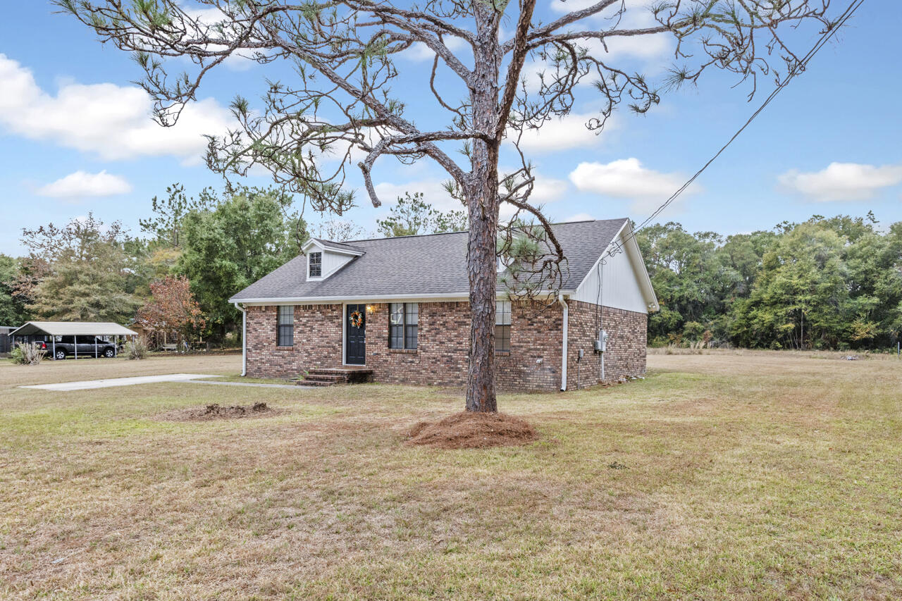 Welcome to this charming 4-bedroom, 2-bathroom home set on a spacious and beautifully cleared half-acre lot. Offering both privacy and room to grow, this property features a welcoming brick exterior and a bright, inviting interior perfect for comfortable everyday living.

Step inside to an open-layout living and dining area filled with natural light and updated flooring. The kitchen offers ample cabinet space, stainless steel appliances, and easy flow for cooking and entertaining. A versatile bonus room provides the ideal space for a home office, playroom, or hobby area. All bedrooms are generously sized, and both bathrooms are well maintained for move-in-ready convenience.

Outside, enjoy the peaceful surroundings, mature trees, and the freedom of a wide-open yard.