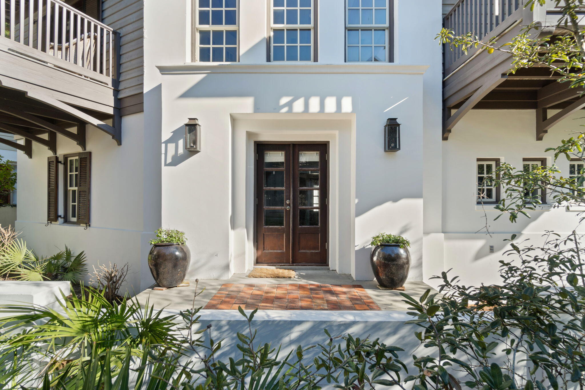 Discover the fine craftsmanship and graceful charm Tortuga Cottage has to offer, right in the heart of Rosemary Beach's iconic south side. This charming 5 bedroom, fully furnished home just off the boardwalk is a mere few minutes' walk to both shopping and dining as well as the beach. The large courtyard, perfect for alfresco entertaining, leads to a double door entry where the homes elegance showcases an open living room/dining room with volume ceilings, fireplace, walls of windows & adjoining the professionally equipped kitchen. There is a private suite on the main level as well as a half bath for guests. A 2nd floor walkway overlooks the main level and leads to two additional bedroom suites. Also on the property is a 2-car garage and carriage house featuring a spacious living area, fully equipped kitchen area, queen bedroom and twin bedroom loft. This is one of the most ideal locations in Rosemary Beach.