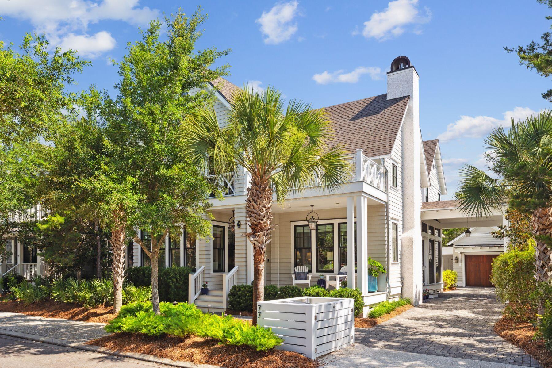 Welcome to your coastal sanctuary in the acclaimed beachside enclave of WaterSound Beach. Nestled in a community renowned for its pristine mile-long stretch of private beaches and over seven miles of scenic boardwalks, 77 Salt Box offers an elevated lifestyle in one of 30A's most sought-after destinations.
A gracious front porch with rich Ipe decking invites you into this designer-curated residence, where timeless Nantucket-inspired architecture meets elevated coastal living. Built in 2017 and maintained in like-new condition, the home sits on a generous lot with a porte-cochere, garage, and ample parking. Thoughtful landscaping surrounds the property, leading to a peaceful backyard oasis complete with lush greenery and a tranquil water feature. The main level features a spacious primary suite and open-concept living area that seamlessly blends indoor and outdoor living with bi-fold doors opening to an expansive screened entertainment porch featuring a built-in gas grill, dining and lounge areas
Perfect for the discerning host, the chef's kitchen is outfitted with premium appliances including a 6-burner gas range, steam and convection ovens, Sub-Zero refrigerator, wine fridge, and ice maker. A separate spacious butler's pantry keeps the main space pristine and functional. A bespoke wine room adds a refined touch for wine enthusiasts.

Light pours into the dining area through three walls of windows, and a cozy gas fireplace with coastal detailing enhances the inviting living space. With three screened porches, there's always a peaceful spot to enjoy the Gulf breeze.
Upstairs, guests will appreciate two spacious bedrooms, a lounge area with wet bar, and a sense of privacy and comfort. Additional highlights include a large laundry room, abundant storage, and thoughtfully designed spaces throughout for full-time living or luxurious beach getaways. With an eye to the future, the home features a generator, elevator shaft and plans for a private pool.
This home conveys with a golf cart for effortless access to multiple beach boardwalks.  Residents enjoy multiple community pools, a beach café, fitness center, playgrounds and puttering park.