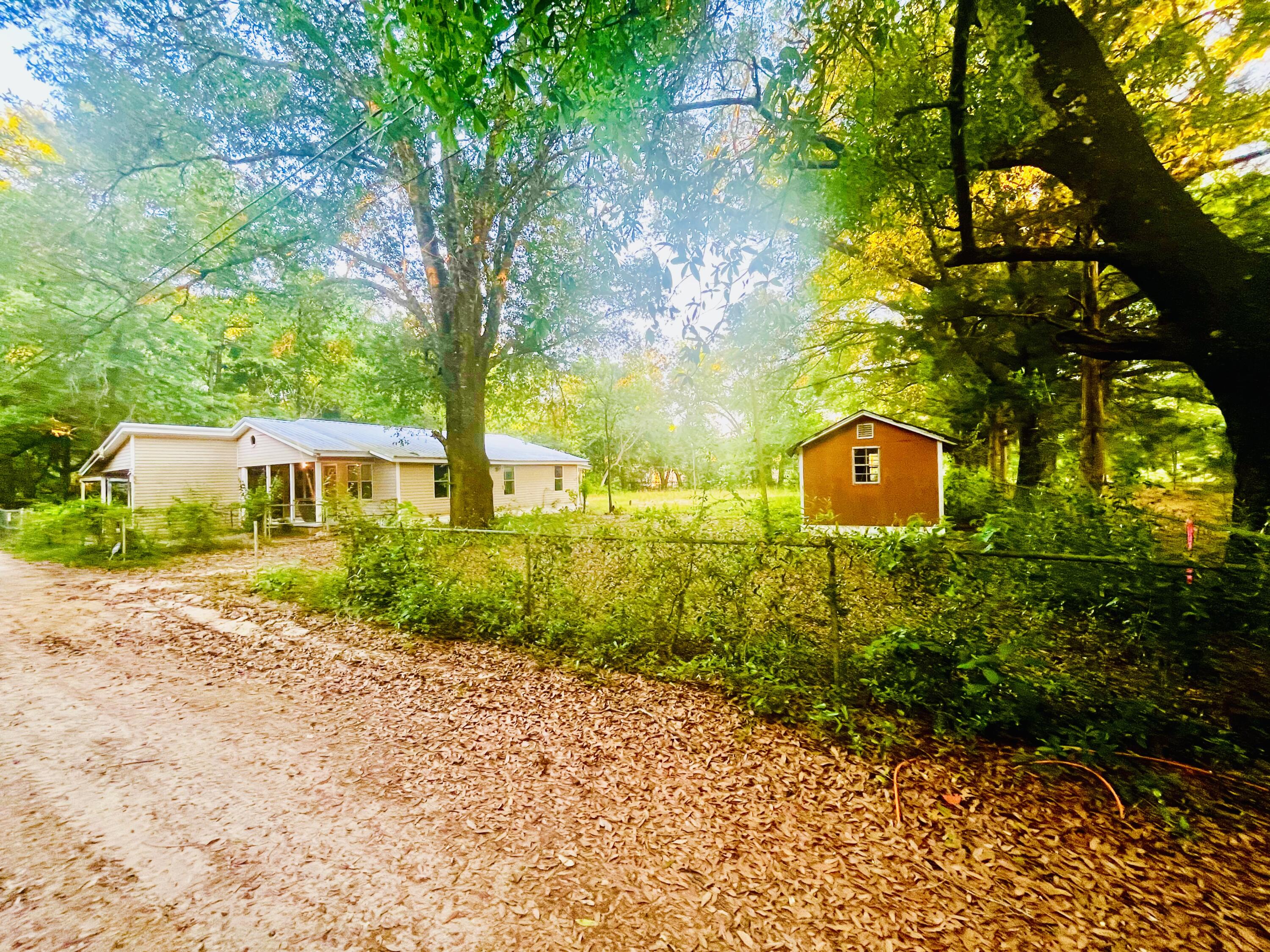 Investor Special or DIY Opportunity! This 2-bedroom, 1-bath home is located near Highway 90 and has been fully stripped down to the studs—offering a clean slate for your next project. Whether you're an investor looking for your next flip or a homeowner ready to customize every detail, this property provides the ideal foundation. Situated on approximately half an acre, there's plenty of room to create the layout and features that fit your vision. Property is being sold as-is and is ready for renovation. Zoned for commercial use, adding potential for future development or business use (buyer to verify zoning and usage with the county). Don't miss this opportunity!