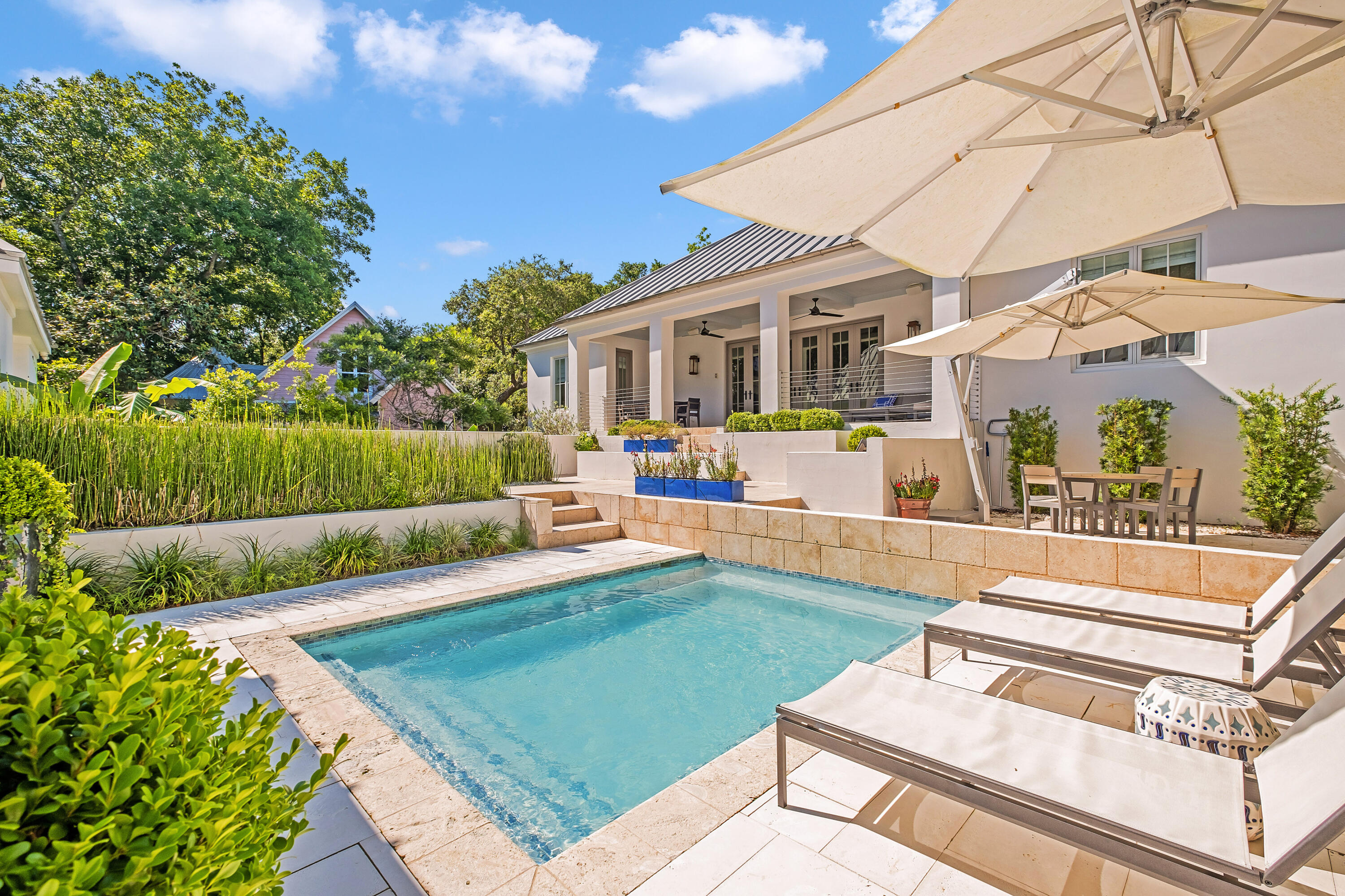 Property is under contract with a kick out clause in place. Rare beachside compound ideally positioned in the heart of Old Seagrove with excellent proximity to Seaside Town Center with masterful concrete block construction and curated interior design. Comprised of a sprawling main house and centralized courtyard complete with a private resort style pool & lush manicured grounds, this property also offers a separate guest house and additional two car garage. Completely renovated in 2019, notable features include six bedrooms, six full baths, solid oak wood flooring throughout, open floor plan & exceptional indoor / outdoor living. The primary living space is conveniently located all on one level and offers exceptional privacy from the walled courtyard. The interior living space is anchored by a finely appointed chef's kitchen complete with custom cabinetry, dolomite waterfall countertop and stainless steel Thermador appliances including a 48" gas range. There is a spacious living room as well as a secondary game room and living space for optimal entertaining. The main floor level features three spacious bedrooms including the primary suite which yields a spa-like ensuite bathroom & ample privacy. The carriage house is completely self contained with a full kitchen and living space as well as an idealistic primary suite. The downstairs level offers two bedrooms and a thoughtful secondary living area. This property is the perfect primary, secondary or rental opportunity with incredible positioning in the heart of 30A directly adjacent to the new urbanism community of Seaside with its boutique shopping, dining and entertainment as well as excellent beach access due south of the home.