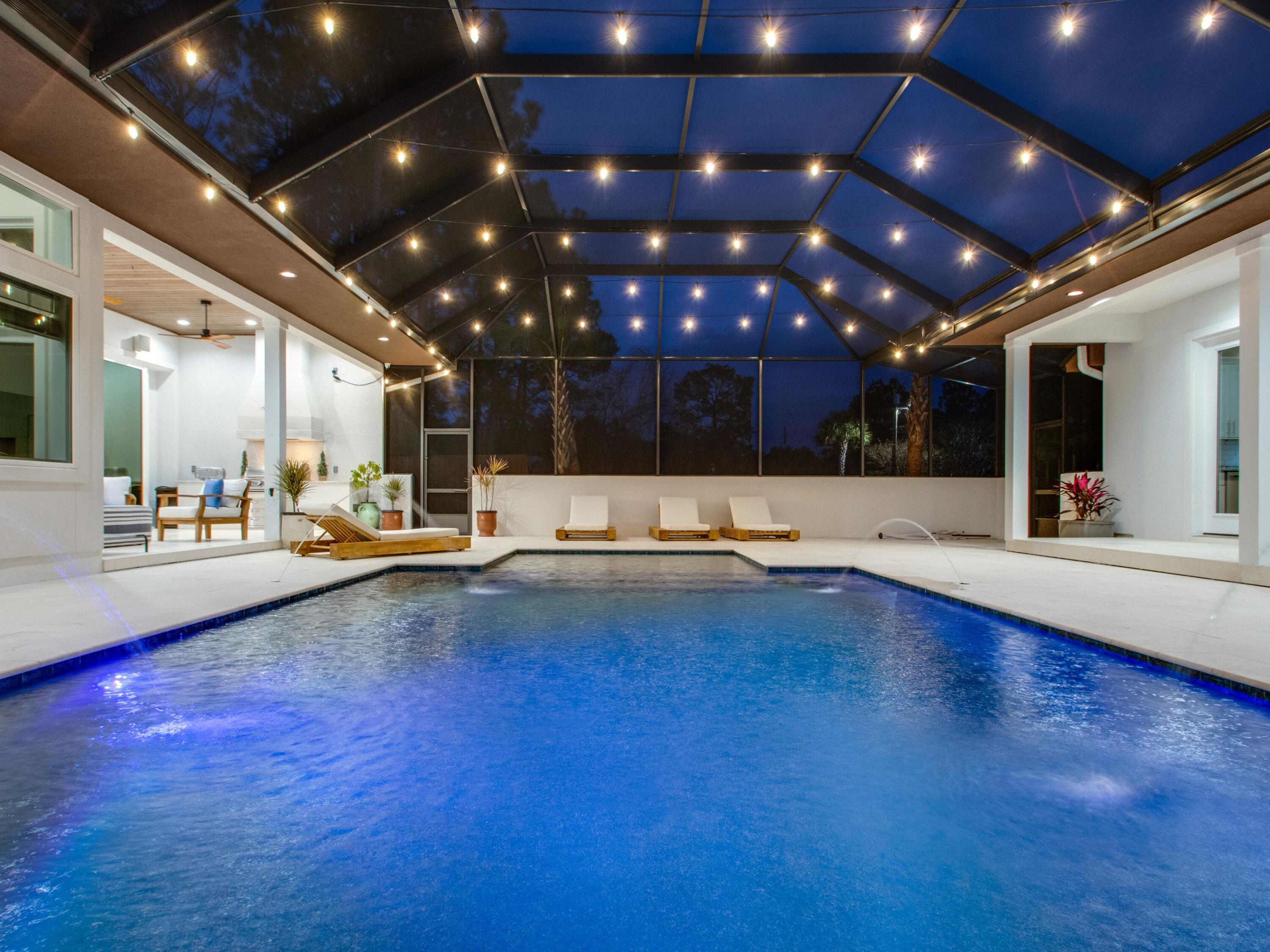 Modern elegance, luxe furnishings and a prime location come together to create the ideal contemporary coastal property in Blue Mountain Beach, complete with an expansive outdoor oasis. Located centrally between two prominent public beach access points, this spacious 3,872-square-foot single-level home was completed in 2020, providing a better than new experience for those desiring new construction without the wait. 

An articulated three-bedroom and three-and-one-half-bath floor plan is spread consciously throughout the main home, offering ample space for relaxation, family togetherness and fun. The inspiring chef's kitchen is furnished with a ZLine Professional Range, commercial-style oversized fridge, wine cooler and ice maker. Details such as Karndean contemporary LVT flooring and a painted brick fireplace provide tastefully modern accents throughout the home. 

Southern-infused luxury continues from the main home into the detached mother-in-law suite, complete with an open living space, kitchenette with glass top range and a private bedroom. Both the main home and mother-in-law suite offer direct access to the stunning outdoor entertainment space fully equipped with a resort-style pool, fully screened-in lanai, built-in grill with exhaust fan and plenty seating for al fresco dining. 

The oversized epoxy floor garage is a dream for motorsports lovers, while the paver driveway provides plentiful overflow parking for family and friends. Located on a spacious corner lot in the Pines at Blue Mountain, this like-new property provides privacy and convenience with fully wrapped Scandanavian inspired privacy fencing.