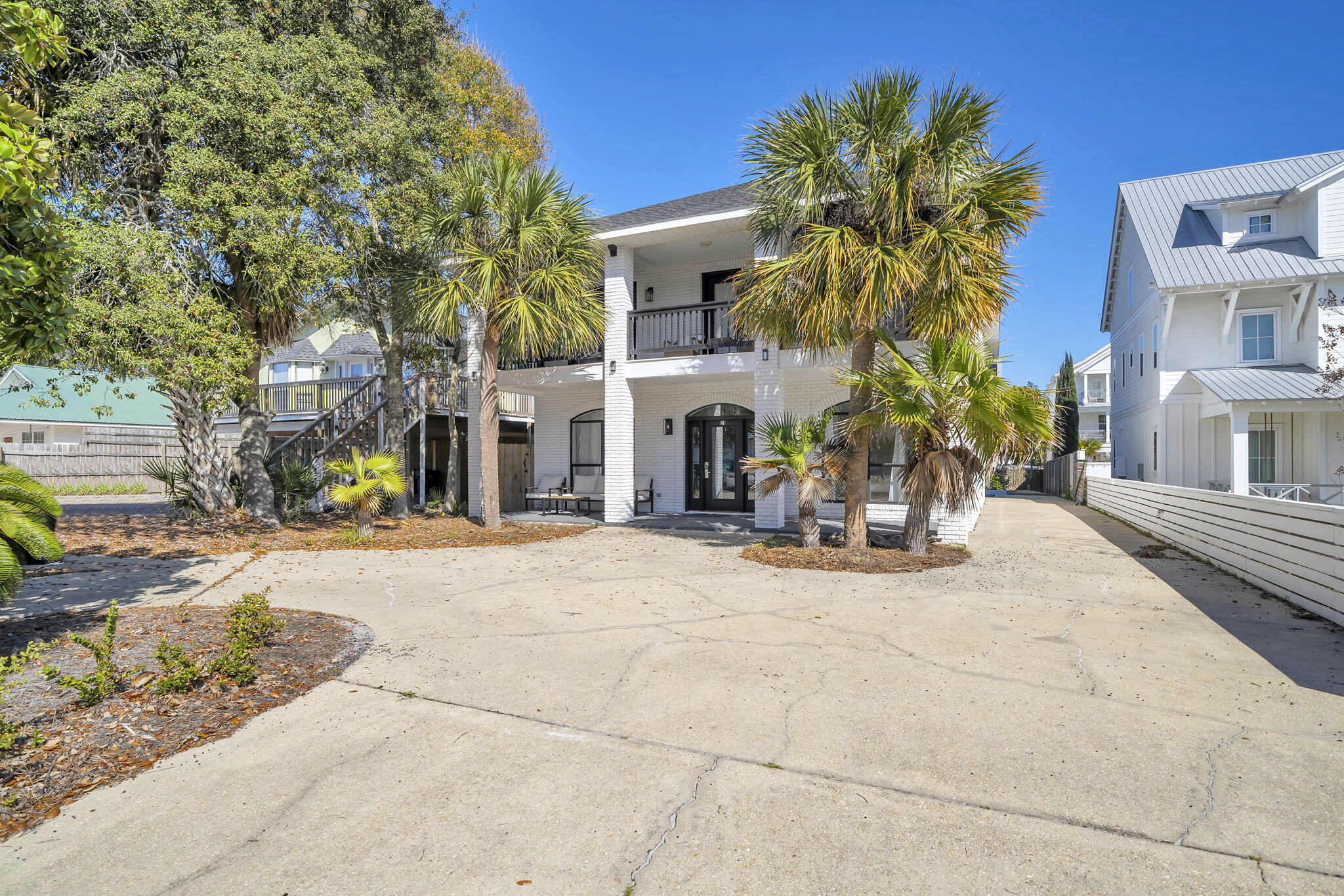 Just one block from the sugar-white sands of the Gulf, 91 Cobia Street offers the perfect blend of coastal luxury and exceptional investment potential in Destin's highly sought-after Crystal Beach community with 120K in rental income booked for 2026. This beautifully renovated beach home features six bedrooms and three-and-a-half bathrooms across more than 2,500 square feet, providing ample space for large gatherings and vacation guests. Inside, the home showcases stylish upgrades including new flooring, quartz countertops, and a bright open-concept layout designed for effortless entertaining. Large living and dining spaces flow seamlessly together, creating an inviting atmosphere perfect for hosting family and friends after a day at the beach. Step outside to your own private resort-style setting, complete with a brand-new pool, outdoor kitchen, and a rare private pickleball court--amenities that help the property stand out in the highly competitive Destin vacation rental market. Multiple porches and balconies offer the perfect place to unwind in the coastal breeze while enjoying Crystal Beach's relaxed charm. With its unbeatable one-block walk to the beach and close proximity to Destin's top dining, shopping, and entertainment, the property is ideally positioned for both personal enjoyment and strong rental performance. Whether you're seeking a luxury vacation retreat, a turnkey income-producing property, or the best of both worlds, 91 Cobia Street presents an exceptional  opportunity along the Emerald Coast.