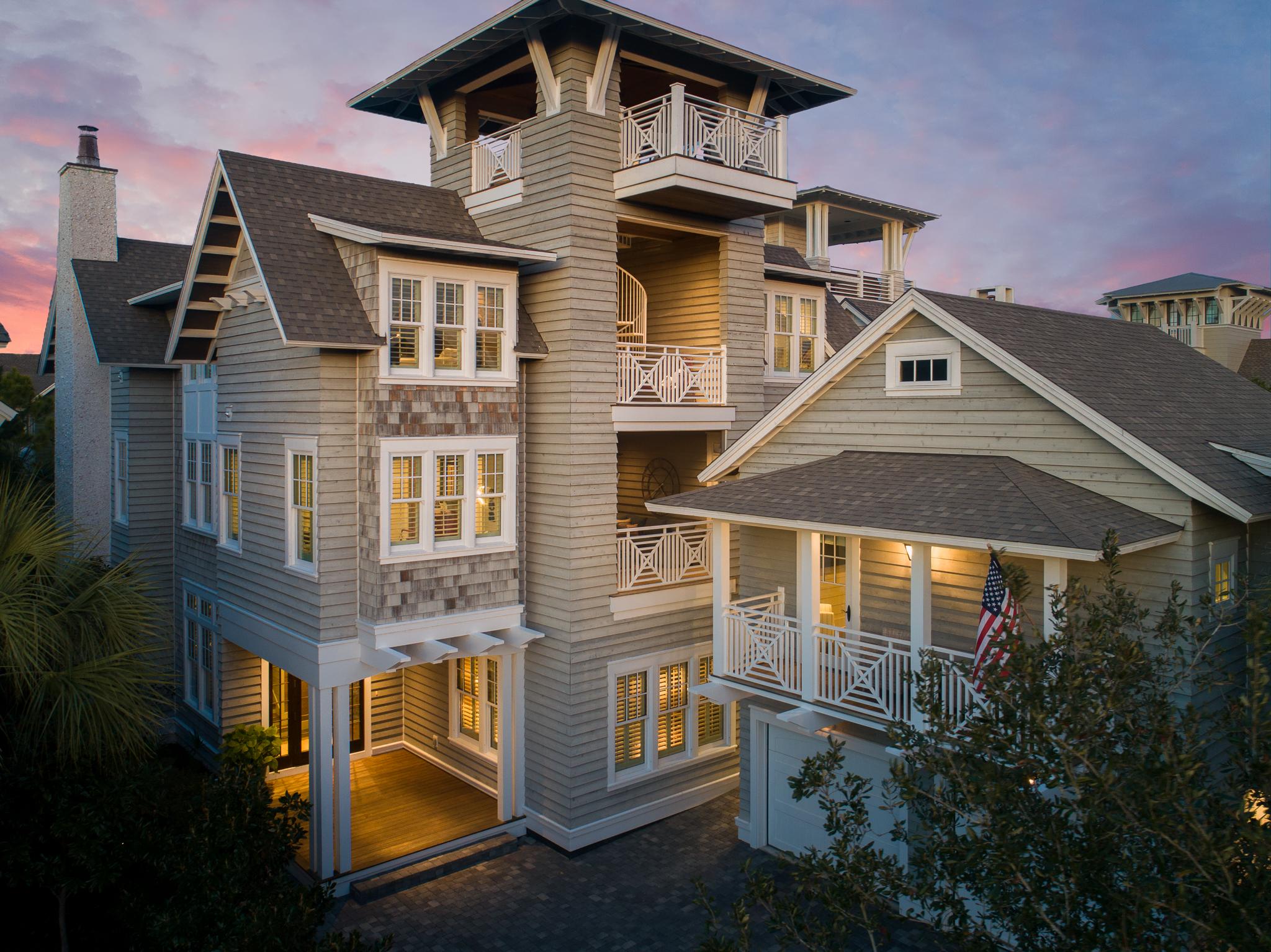 With its timeless, elegant architecture and ideal location on a quiet, premier, tree-lined street this Coastal estate stands apart as one of the finest private residences ever offered in WaterSound Beach. This incredible property features a 5 bedroom, 5-1/2 bath main residence, 1 bedroom, 1 bath carriage house and 2-car garage. Infused with dazzling natural light and defined by turn-key elegance, the main residence captures every imaginable luxury for world-class entertaining and offers sweeping views from the 4th floor tower.
Real wood tongue & groove 12-foot walls grace the entirety of the home, leading the way to an elegant library and oversized first floor laundry room. An elegant hall leads to the great room with pecky cypress trey ceilings open into the kitchen and adjacent trey ceilings open into the kitchen and adjacent private dining room. Quartzite countertops elegantly sit atop the custom pecky cabinetry and flanking the oversized island. Thermador gas stove and refrigerator, a pair of Bosch dishwashers and freezers drawers only add to the quality of the chef's kitchen.

The 2nd floor offers a master retreat with his and her closets and spa-like bath, with access to the rear screened-in porch.  Three guest quarters with en-suites, a 2nd-floor laundry and screened-in porch complete the second floor. Taking the elevator to the third floor, a wet bar/morning kitchen and secondary media room await.  The outdoor seating area opens to the spiral staircase to the tower where stunning gulf views beckon early morning coffee watching the sunrise.

Additional amenities to the home include Pecky Cypress accenting the ceilings & custom doors throughout the home, whole house central vacuum system, Nano doors, outdoor kitchen, heated pool, custom furnishings, 2-car garage and one-bedroom carriage house complete this coastal residence.

Enjoy all of this among the exclusive luxuries and amenities of WaterSound Beach, just a stone's throw from the world-class beaches and a short Golf cart or bike ride away from award-winning restaurants, shopping and more.
