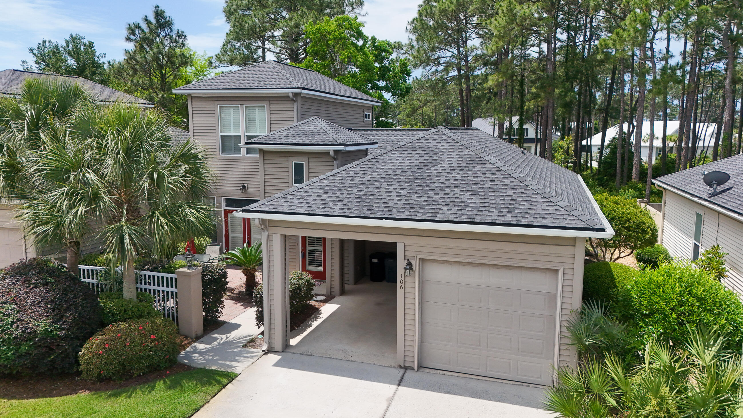 A Great Location!!  This furnished home is in a quiet, gated and well sought out neighborhood backed up to a preserve. A short walk to the beach and 1 block from the Santa Rosa Golf Course. Plantation shutters throughout entire home. There is a swimming pool and cabana within the community. The houses are attached two by two with a carport and garage attached to each unit. Parking for two cars and golf cart. Golf cart conveys with property. There is a front and back courtyard for relaxing and privacy. This community does not have short term rentals.