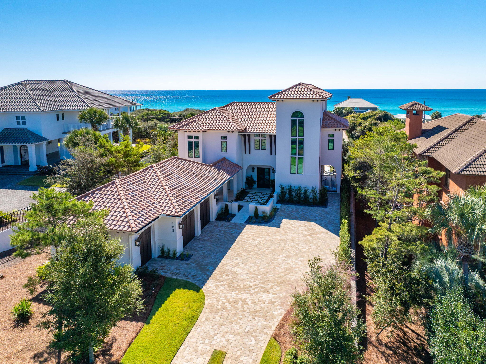 A Refined Coastal Retreat on 30A's West End

Tucked behind the gates of BellaMar at Gulf Place, this newly built coastal retreat is one of only seven homes fronting iconic 30A, offering a rare blend of privacy, connection, and elevated coastal living. Positioned just over 34 feet above sea level in Flood Zone X, the home was designed for entertaining and quiet retreat alike, with multiple indoor and outdoor gathering spaces, including a covered lanai overlooking the heated and chilled saltwater pool in a serene, private setting.

Upper-level terraces and the third-level office and flex space capture sweeping views toward Sandestin Golf & Beach Resort. Built in late 2022 by Grand Bay Construction alongside architect Jeff Margaretten and landscape designer Chad Horton, the home reflects exceptional craftsmanship and cohesive, refined design.

Additional highlights include warm white-oak finishes, Sub-Zero, Wolf, and Cove appliances, a coffered-ceiling great room with integrated screened porch panels, a three-stop elevator, service lift, Sonos audio system, and an oversized temperature-controlled garage.

Located at 102 Sea Winds Drive in Santa Rosa Beach, Florida, this home enjoys a premier setting within BellaMar, a private, rental-restricted community bordered by Santa Rosa Golf & Beach Club. Owners enjoy deeded beach access, spacious homesites, and walking trails leading directly to Gulf Place Town Center, creating a rare balance of privacy, connection, and convenience. The primary suite adds warmth with exposed white-oak beams. The kitchen is a chef's dream with Sub-Zero, Wolf, and Cove appliances. Additional features include a three-stop elevator, service lift, temperature-controlled garage, and Sonos audio system with three zones. The third-level flex space, finished in Venetian plaster, opens to a sunset deck where Gulf views stretch toward Sandestin Golf & Beach Resort - a breathtaking backdrop for evening gatherings. This level also offers potential for a wet bar or bath, with access to waterlines in the walk-through attic.

BellaMar is a private, short-term-rental-restricted community bordered by the Santa Rosa Golf & Beach Club, offering spacious homesites, deeded beach access, and sidewalks to Gulf Place Town Center - an ideal blend of tranquility and connection along 30A's west end. Nearby, Santa Rosa Beach offers miles of shoreline, boutique shops, and coastal dining, with state parks, boating, and paddleboarding all close at hand. Experience coastal living at its finest at 102 Sea Winds Drive - where style, comfort, and luxury meet in perfect harmony.