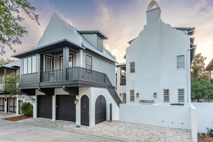 Offering a desirable location just south of Scenic Highway 30A, this exquisite estate has been thoughtfully designed to provide a luxurious coastal lifestyle in the heart of Rosemary Beach. Completed in 2019, this masterfully-designed home was constructed out of solid concrete and provides 4,706 square feet of living space. Open and spacious, first-floor living areas offer elegant finishes that include custom tile work and peacock paver flooring. The great room commands attention with its exposed wood beams and Venetian accent fireplace, while the gourmet kitchen provides an inspiring place to prepare meals with its custom cabinetry, quartz countertops, and environmentally-conscious Italian Bertazzoni appliances. An ideal primary residence, vacation retreat, or rental investment, this seven-bedroom home provides plenty of room for gathering with family and friends. Located on the second floor, a spacious master suite offers its own sitting area and a luxurious spa with a double vanity, rain shower with intricate tile work, and a large soaking tub. Additional bedrooms are found on the second and third floors of the main home, while a detached carriage house offers its own private accommodations with a full kitchen, living area, and bedroom. A spiral staircase leads to a whimsical loft area and a full bathroom. 

This property provides unparalleled amenities and a perfect Rosemary Beach location. Private amenities include serene outdoor living spaces, an expansive outdoor fireplace, and a pool. A two-car garage allows for additional parking or storage space. Residents of this Rosemary Beach retreat can enjoy a central location that is close to the community's best shopping and dining destinations and only steps from the community pool. Best of all, beautiful Gulf of Mexico beaches are just a quick walk away.