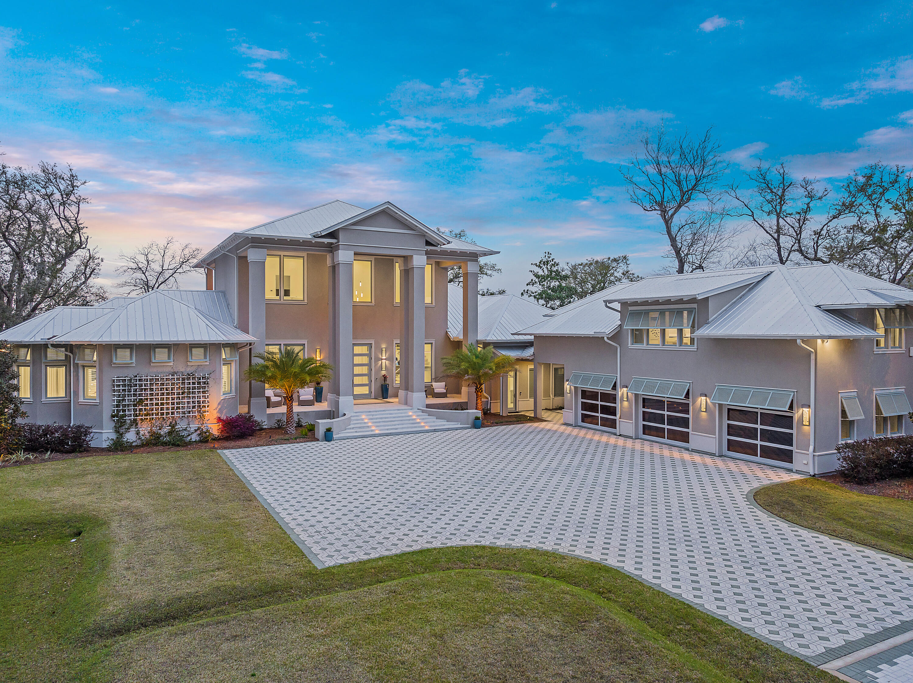 Concrete, Custom Construction...Double Lot...Full Size Carriage House...Dock with lifts....Bayfront Luxury Sunsets...Sold Furnished with list of exclusions...No HOA.  
This Bayfront Estate has it all!  Indulge yourself in the luxury of this Bayfront Custom home located on a double lot, where coastal elegance seamlessly connects with breathtaking vistas across the Choctawhatchee Bay. As you drive through the private gates of this estate, you immediately realize that this is a custom, masterpiece built with unrivaled attention to detail. Upon entering the expansive living area, the inviting custom interiors compliment the panoramic views across the bay. The heart of the home unfolds with a mesmerizing open-concept layout, effortlessly merging the living and dining with a gourmet kitchen and butler's pantry for culinary aficionados and entertainers alike. Hosting soirées becomes an art form in this space.

Discover sanctuary in five lavishly appointed bedrooms, each a haven of comfort and tranquility, thoughtfully crafted with ensuites to elevate your relaxation. Two main suites offer spectacular views of the bay, where private balconies provide owners and guests with the opportunity to bask in the splendor of western sunsets, a daily ritual in this coastal haven.

Venture outdoors and immerse yourself in the quiet refuge offered from the expansive deck where a saltwater pool and rejuvenating hot tub await. Year round sunset views will astound you. Whether it's a family barbecue or an intimate cocktail soirée beneath the evening sky, every gathering here will be filled with memories.

If boating and water-sports are your thing, embark on journeys of discovery from the comfort of your own backyard, courtesy of the covered 8K lb.capacity boat lift along with jet ski lifts.  

Additional features of this home include a stunning carriage home complete with a bedroom, living area, kitchenette and laundry room. A three car conditioned garage with additional room for storage is a major plus. 

Embrace a lifestyle of opulence and tranquility, where the perfect fusion of indoor and outdoor living spaces awaits. With an array of amenities and an unrivaled waterfront locale, this Bayfront retreat stands as a testament to coastal elegance, offering its fortunate residents a haven of luxury and serenity, where every moment is filled with the essence of paradise and making of memories.  

This home is sold fully furnished with a few exclusions.