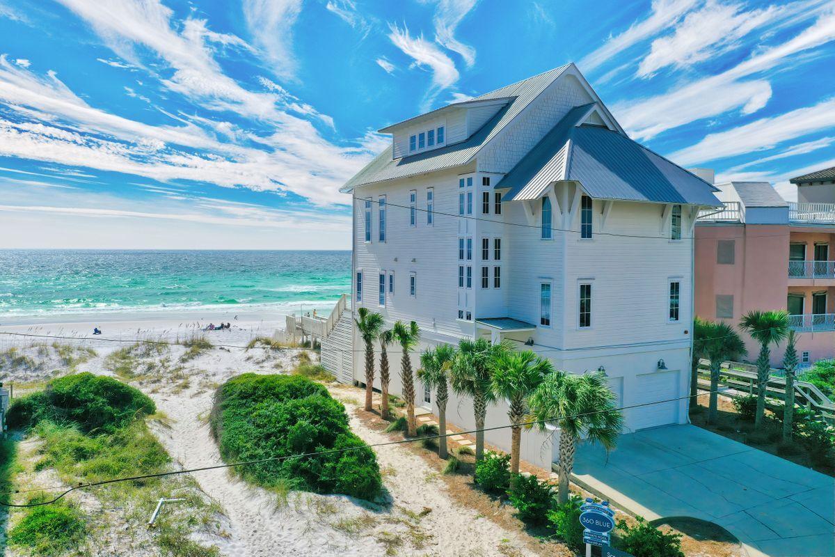 Prominent gulf front positioning and beautiful coastal contemporary architecture & aesthetics define this luxurious beach front residence recently remodeled to both maximize rental revenue and yield an unparalleled family retreat in the heart of Miramar Beach, Florida. This short term rental machine has over $375,000 in projected annual income with excellent history and finely appointed upgrades offering an impressive four story vertical footprint with notable features including a private gulf front pool perched high above sea level to maximize gorgeous unimpeded gulf views. This open layout floor-plan was designed with legacy living in mind offering ample parking including an oversized two car garage as well as fortified construction quality with concrete and frame infusion. The first level offers an oversized lockout suite currently designed with built in bunk beds, full bathroom and a living/sitting area with direct access to the rear pool deck and private beach walkover. The second level offers two full bedroom suites as well as a laundry room, secondary living room and kitchen overlooking the Gulf of Mexico and private pool area through floor to ceiling store front glass. The third level anchors the home as the primary living space with a fully equipped chef's kitchen complete with stainless appliances and stone countertops highlighted by a massive center island with freshly painted interiors including rustic white washed beamed ceilings and ample windows for taking in the elevated gulf views. The third level also features three full bedroom suites with en-suites as well as a spacious covered porch for enjoying the majestic sunset vistas and sea breeze. The top level is occupied by an oversized master bedroom that encompasses the entire space and has been designed as a true suite experience with an adjoining master bathroom, soaring cathedral ceilings and ample room to relax while taking in the pristine panoramic gulf views prominently exposed by white washed tongue & groove walls & ceiling and abundant south facing windows. Open Gulf Street is a private enclave located in the heart of South Walton County adjacent to the world class Sandestin Resort and within excellent proximity to exceptional shopping, private & casual dining, golf courses, Sandestin Marina and local entertainment.