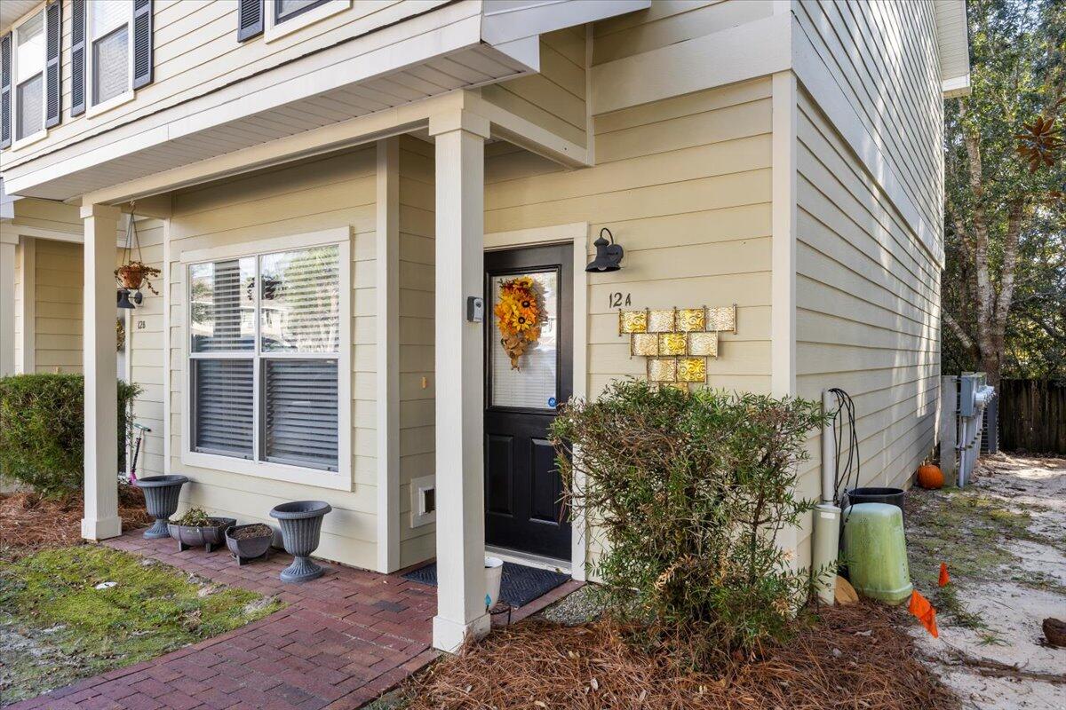 Beautifully updated townhome in the heart of Freeport. This 2-bedroom, 2.5-bath residence features a fully renovated kitchen with new appliances, quartz countertops, fresh paint, and tile flooring. The first floor offers a spacious open-concept living area, a storage closet, and a half bath, along with the kitchen and dining area—each enhanced with new hardwood flooring, updated lighting, and fresh paint.

Upstairs, the primary bedroom includes two closets, updated paint, and a completely remodeled en-suite bathroom with an elegant, high-end design. The second bedroom, also with a large closet and updated paint, sits adjacent to another fully renovated full bathroom showcasing modern, stylish finishes. The staircase and upper-level feature newer carpet, while all bathrooms are finished with tile flooring. Washer and dryer hookups are conveniently located on the second floor, and both appliances are included.

As a corner unit, this townhome provides a private back deck and two assigned parking spaces. It is located directly across from the community pool and dog park in a quiet, low-traffic neighborhood. The community sits just across the highway from the elementary school and offers easy access to local restaurants and shopping, while being only about 15 miles from 30A beach access.