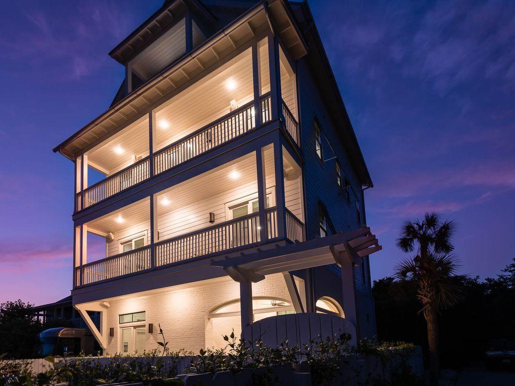 Under contract with 72 hour kick-out clause in place. A stunning, newly constructed property offers luxurious, relaxing Seagrove Beach living at its finest! This home is the epitome of a luxury beach getaway, with the bright and airy feel, the soft and natural furnishings, and the professionally curated decor elements this home has to offer. The residence boasts 6 bedrooms, 7-1/2 bathrooms, private pool and elevator access to all four floors. Enjoy evening sunsets, stunning Gulf views, or listen to the crashing waves from the upper level balconies.
The first floor offers two junior suites, each featuring a king bed and private bathroom with glass-enclosed shower and marble vanity.  Enjoy the private outdoor space on this floor by relaxing on the covered patio in one of the chaise lounges, or take a splash in the private pool.